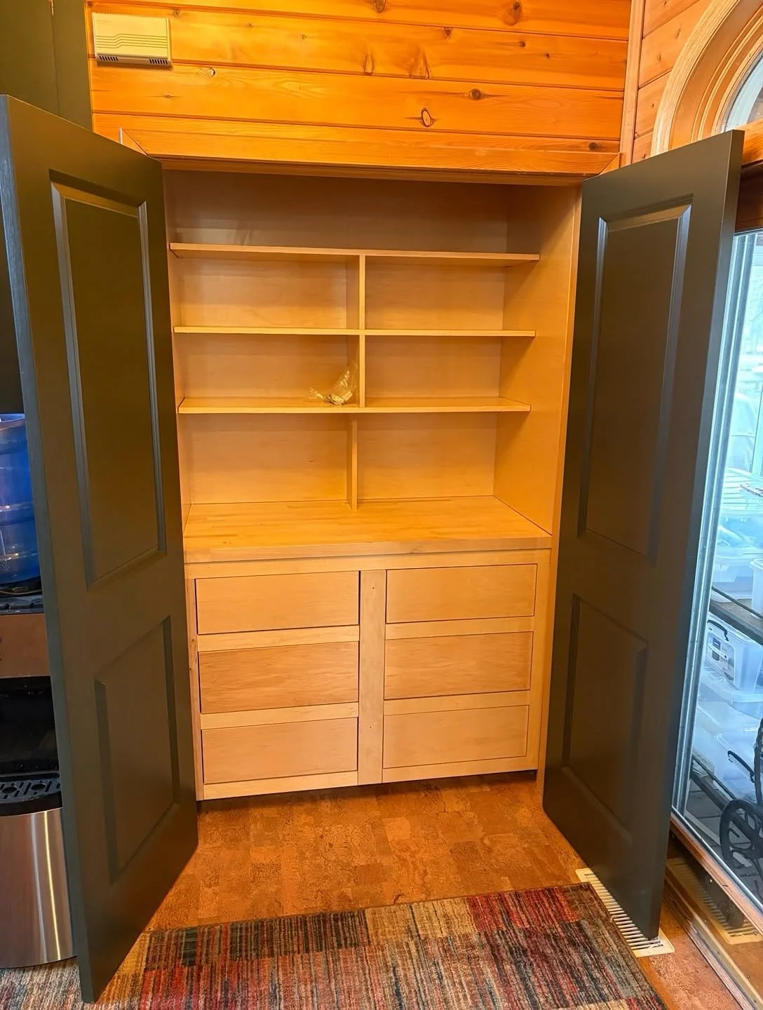 Custom pantry cabinetry in Spicer with shelves, drawers, and counter space