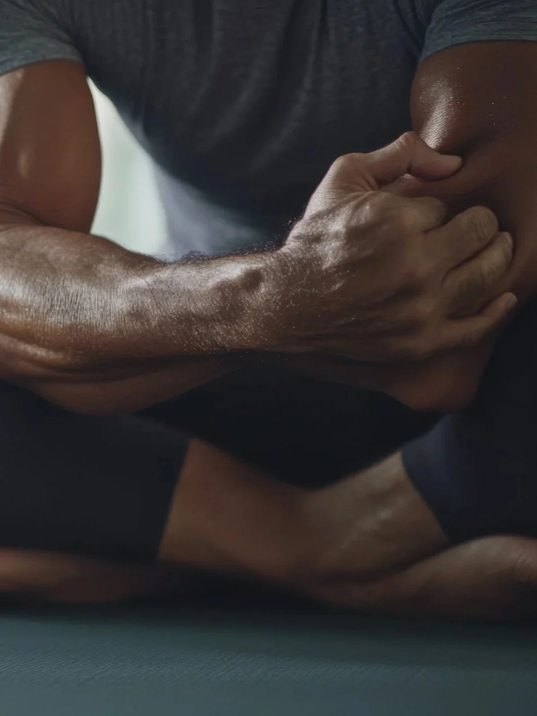 A person holding their elbow, which appears in pain..