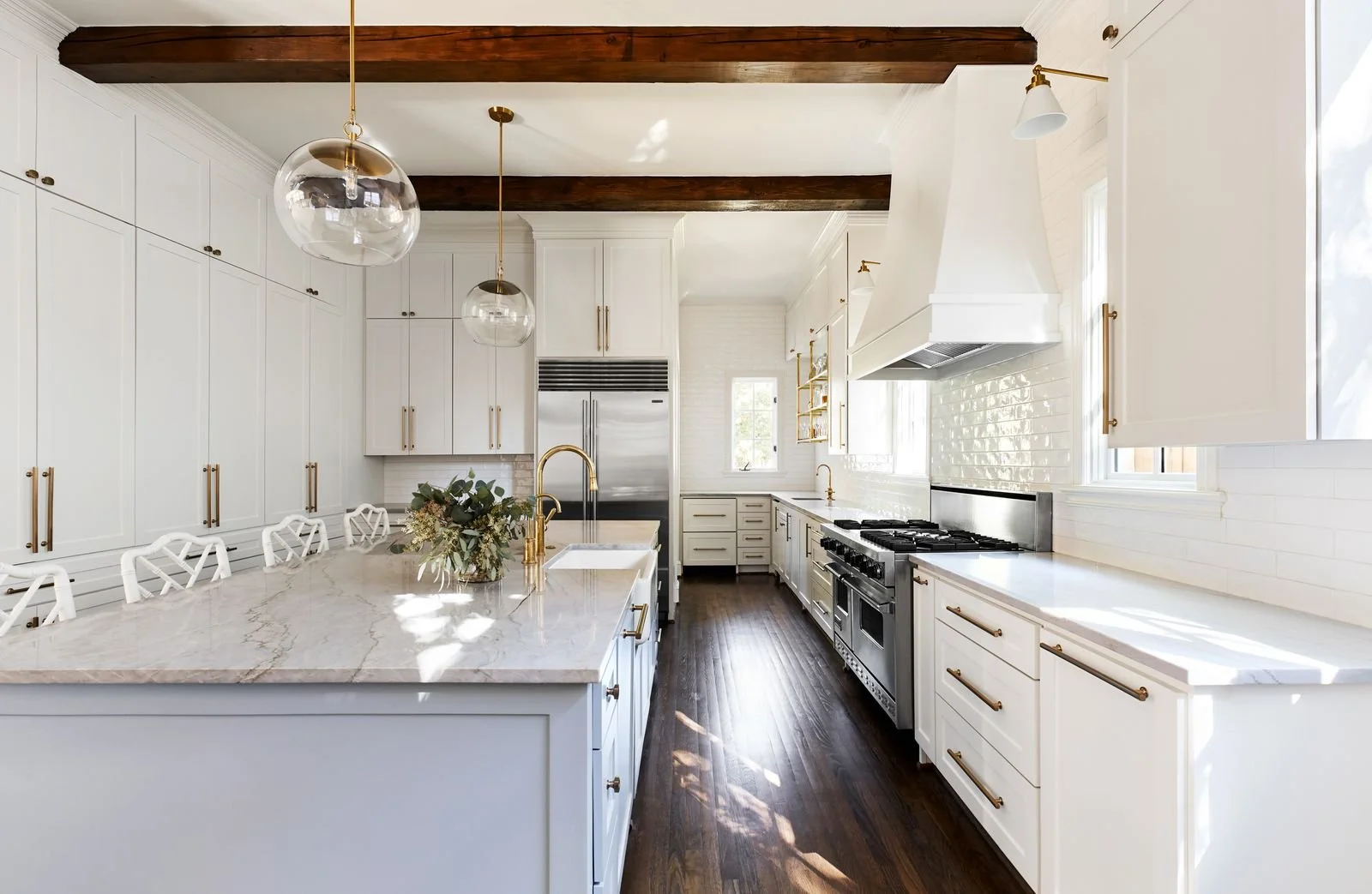 white kitchen design with exposed beams