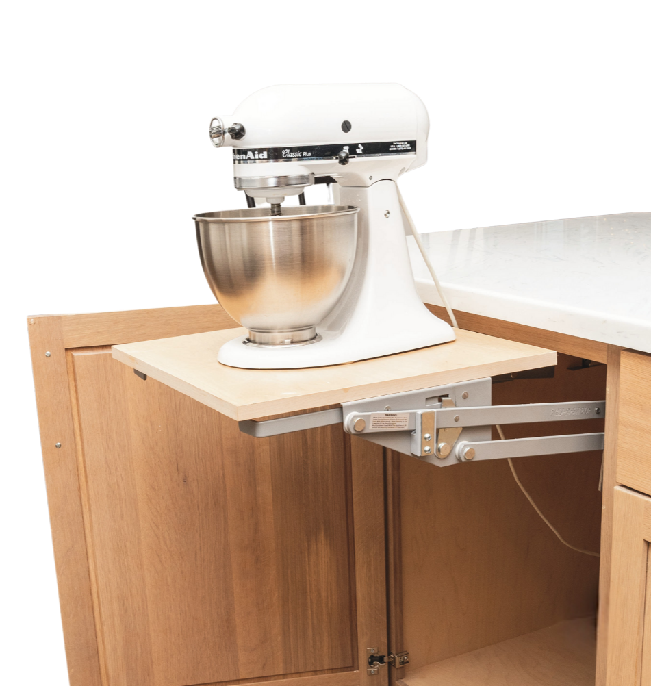 Stand mixer placed on a wooden kitchen cabinet with a sliding fold-out support arm.