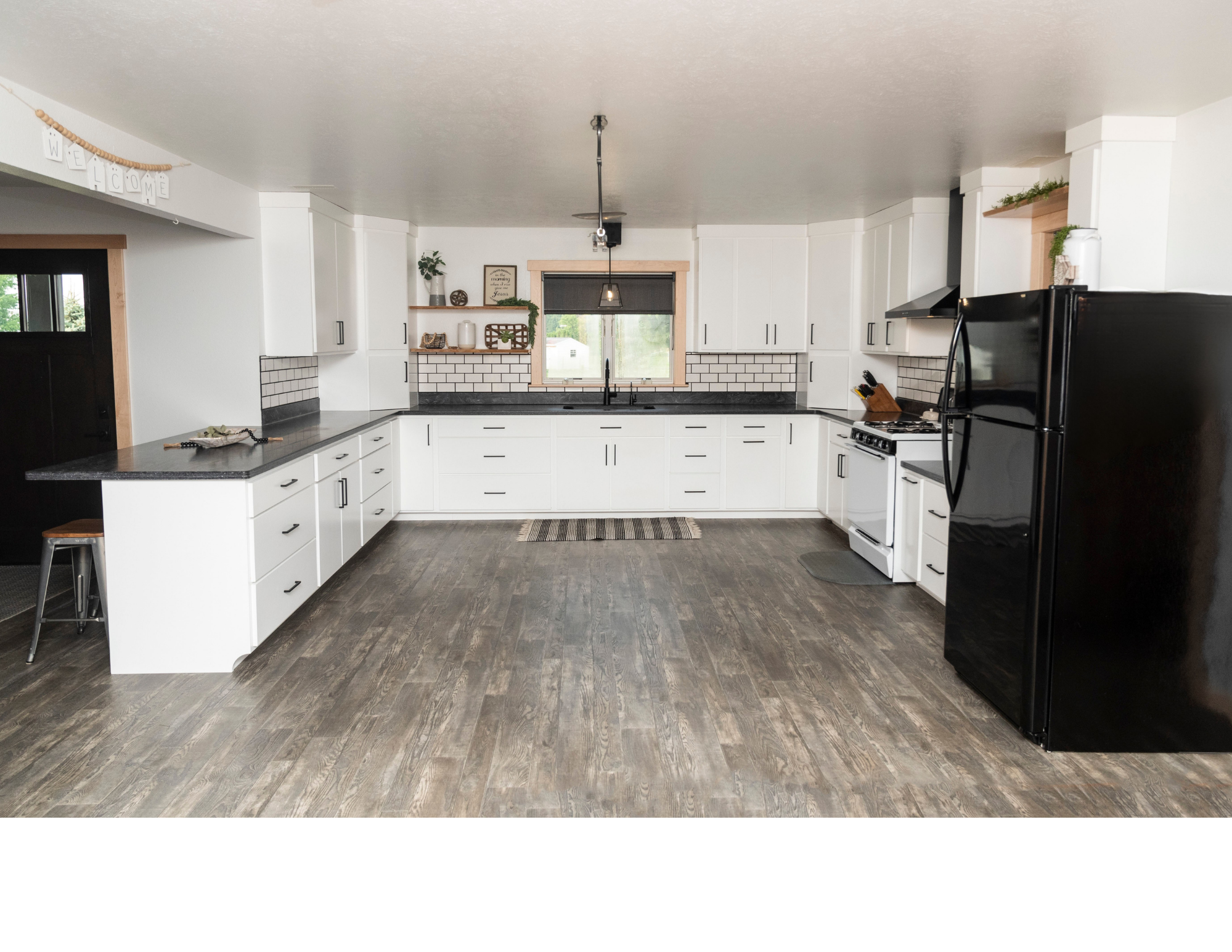 White U-Shaped Kitchen with Split-Level Countertop & Floating Shelves ...