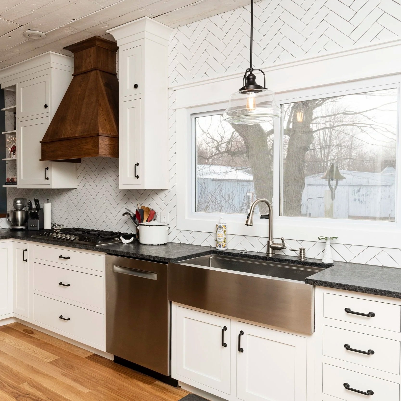 White Kitchen with Custom Wood Range Hood & Stainless Farmhouse Sink