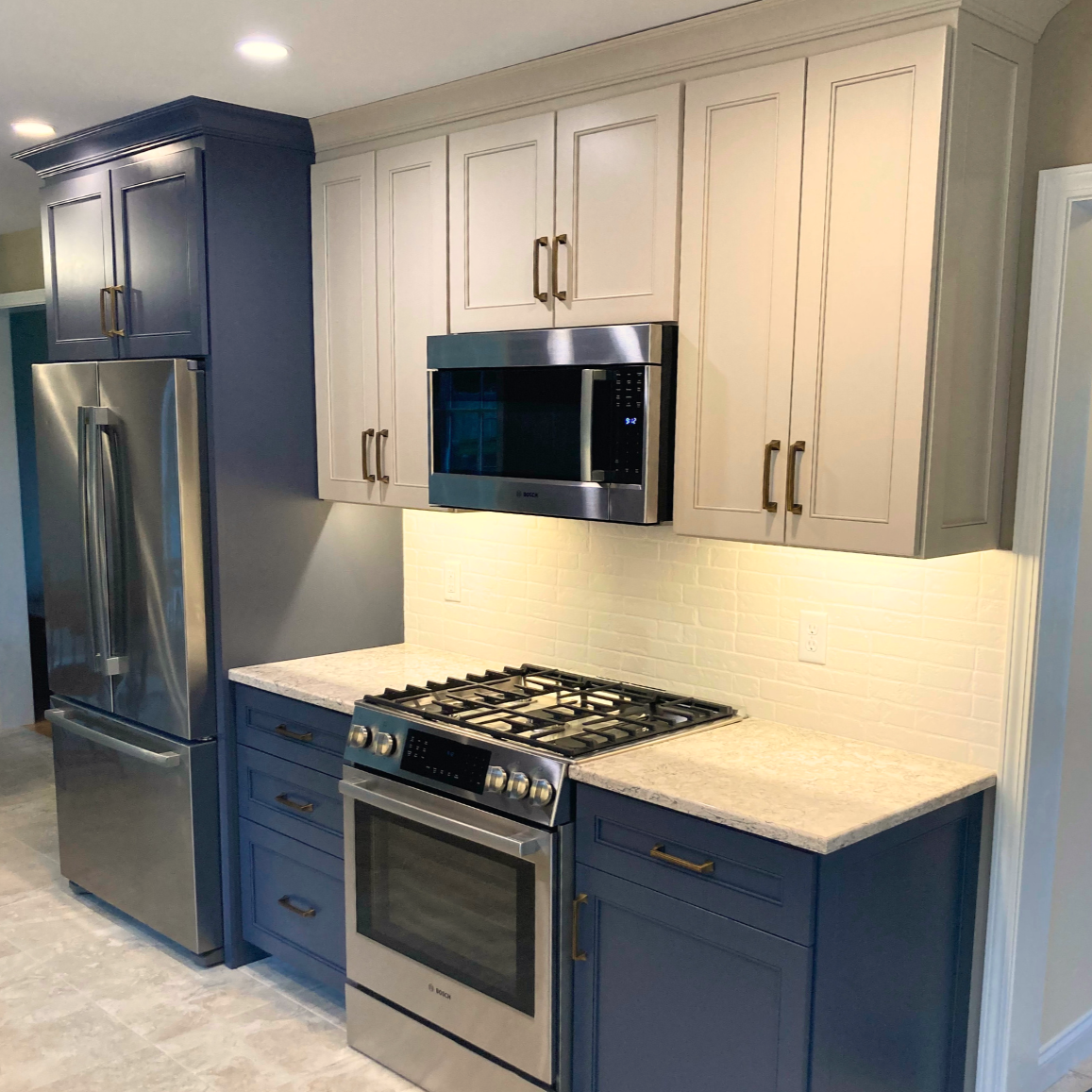 Two-Tone Kitchen with Notre Dame Blue Base Cabinets & Light Gray Wall Cabinets