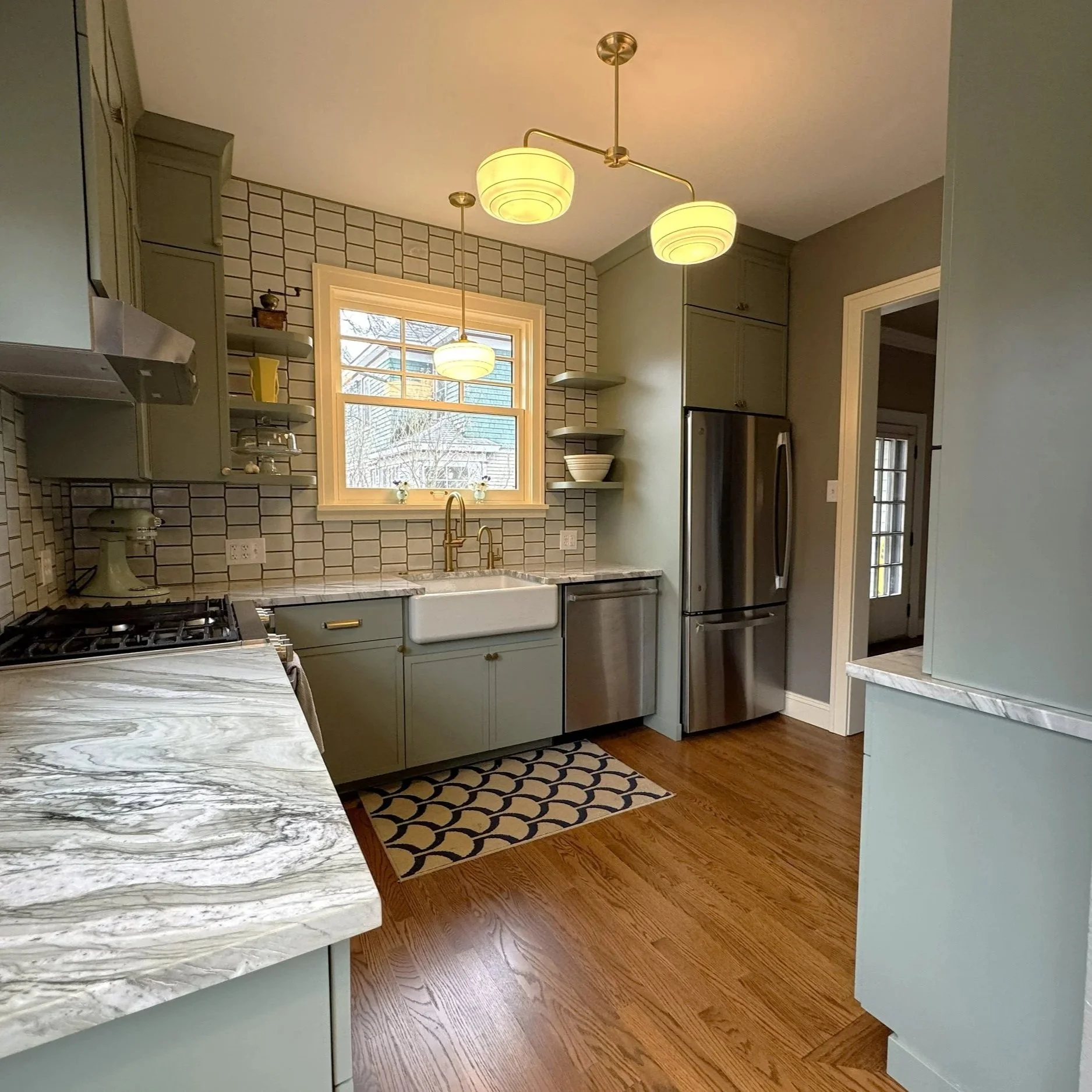 Sage Green Kitchen with Floating Shelves & Farmhouse Sink