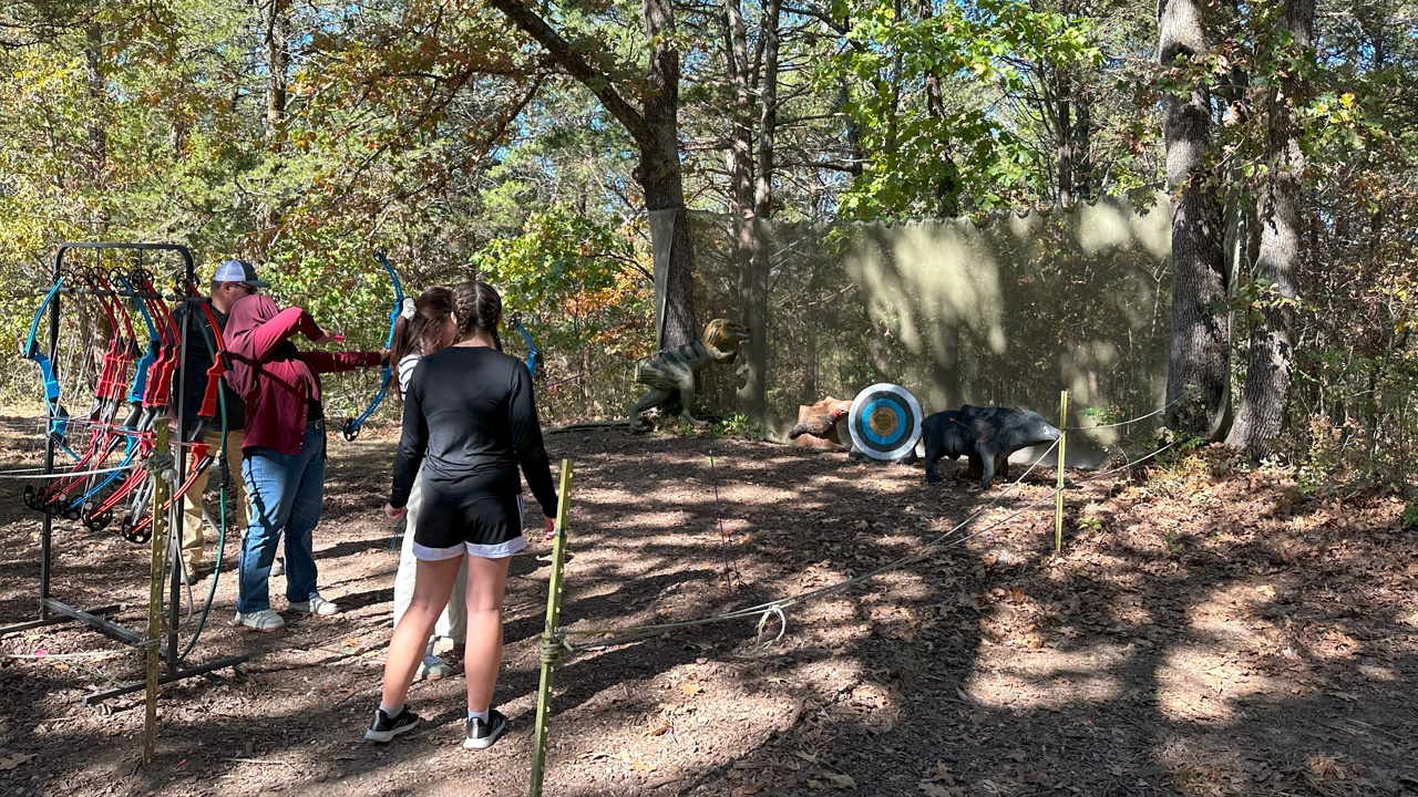 People shooting bow and arrows