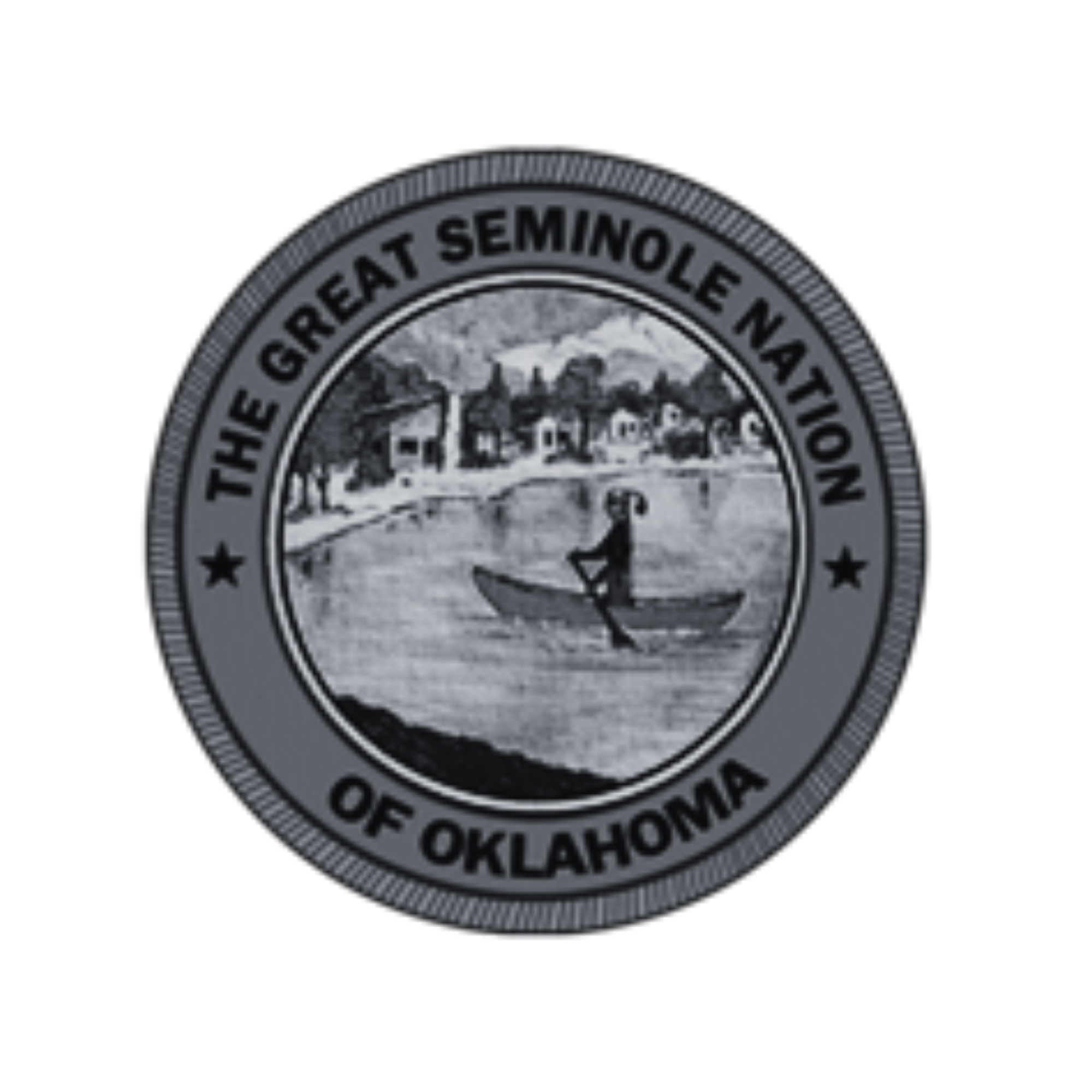 Emblem of The Great Seminole Nation of Oklahoma featuring a person paddling a canoe on a river with a town in the background.