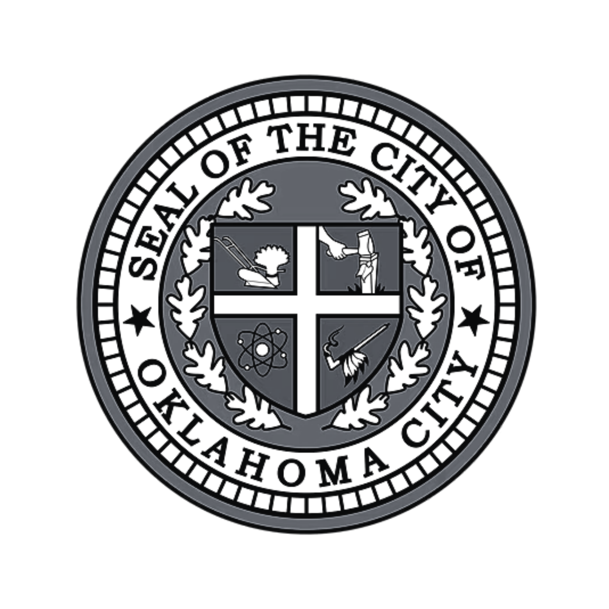 A dark emblem or badge with a circular design, featuring a shield divided into four quadrants with various symbols, surrounded by a wreath, and inscribed with text around the circle.