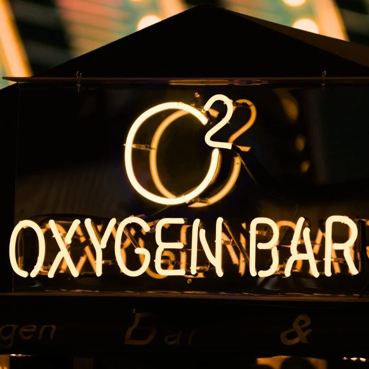 Neon sign displaying 'Oxygen Bar' with a large number 22 above it.