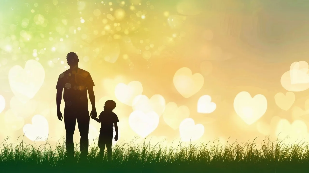 Silhouettes of a father and child holding hands in a grassy field with a colorful, glowing background featuring heart shapes.
