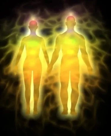 Silhouettes of a father and child holding hands in a grassy field with a colorful, glowing background featuring heart shapes.