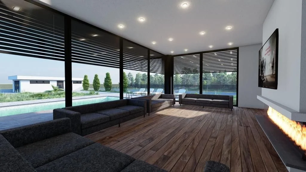 A modern living room with large glass windows, dark sofas, a fireplace, and a flat-screen TV, overlooking a pool and outdoor seating area.