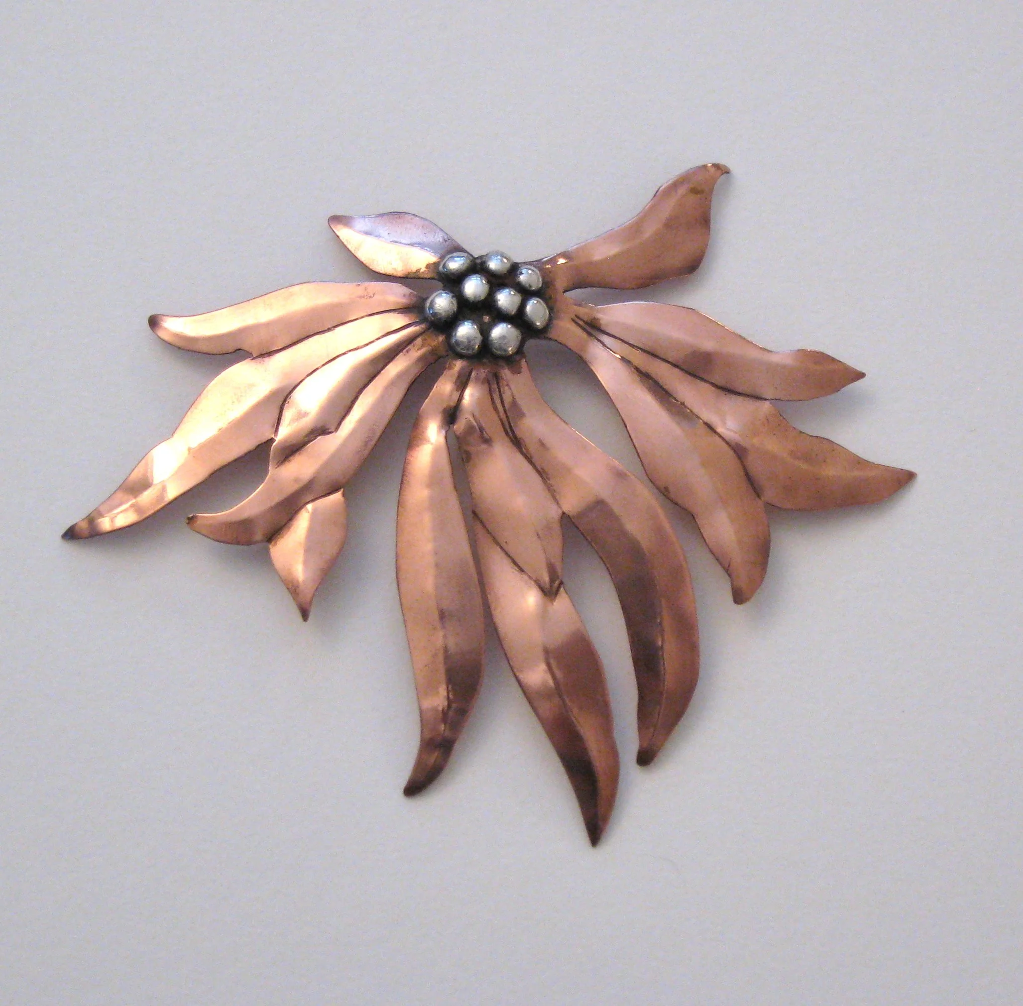 Copper poinsetta lapel pin