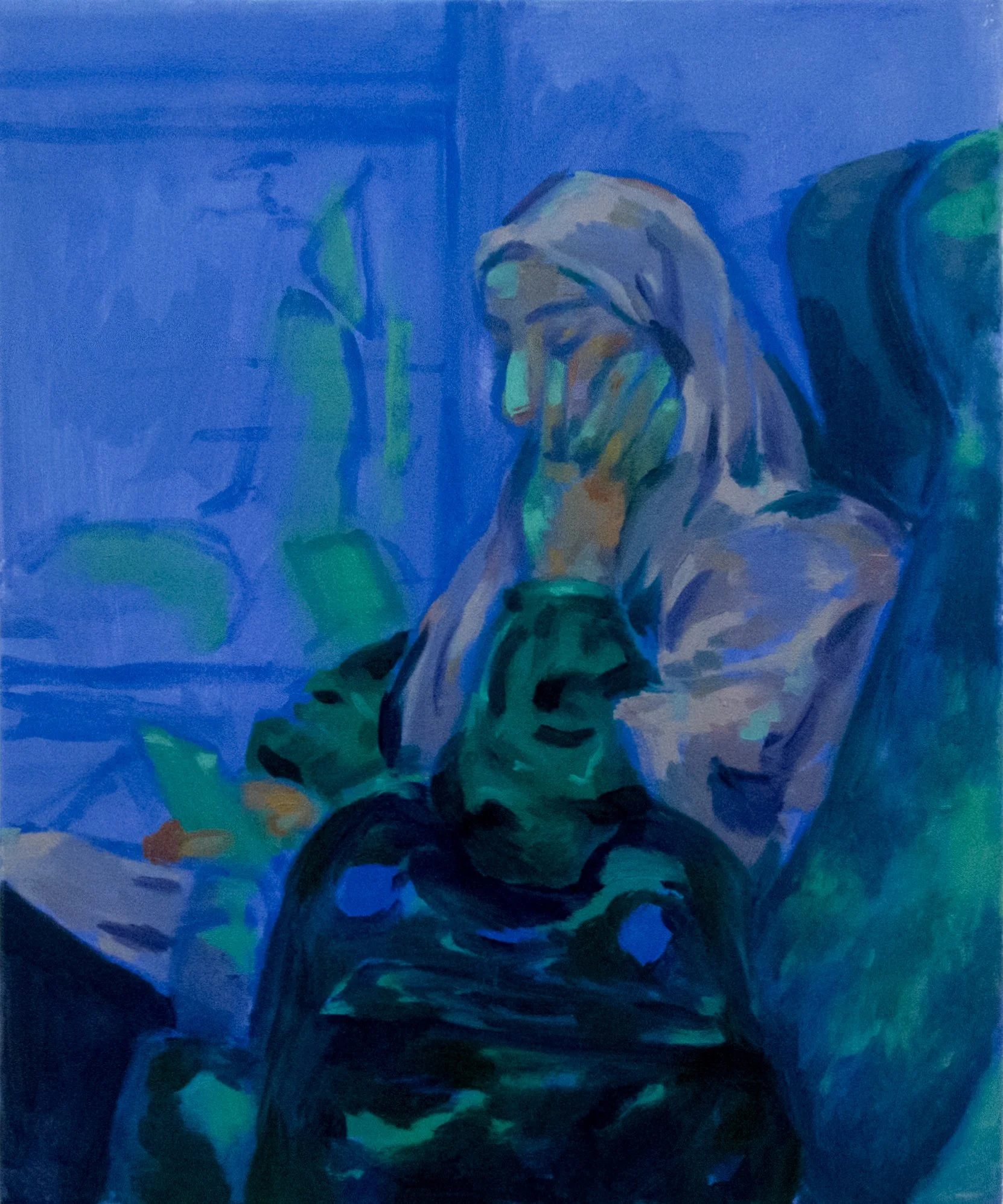 A person with long hair leaning on a table or surface, holding his head with one hand, against a background of blue and greenish hues.