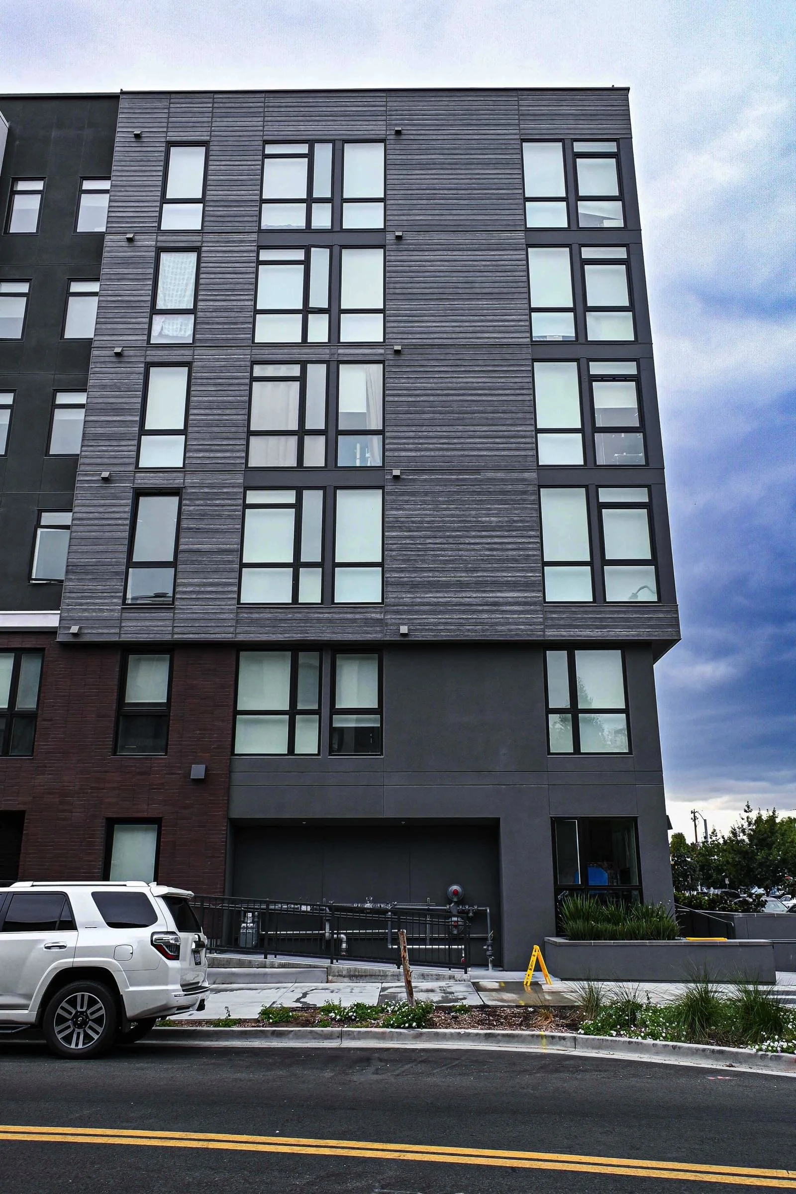 detail view of sixth and jackson showing grey and brown siding