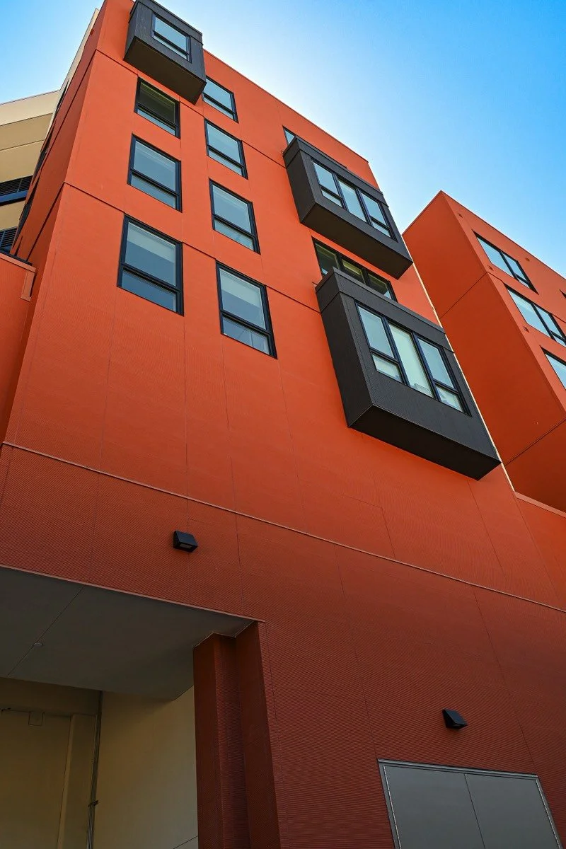 closeup of orange section looking up from sidewalk