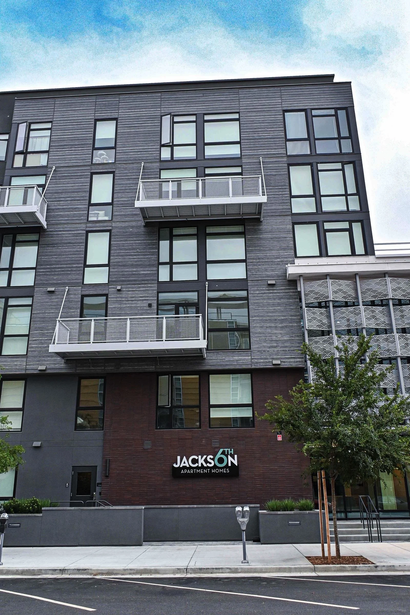 detail view of sixth and jackson building gray with balconies