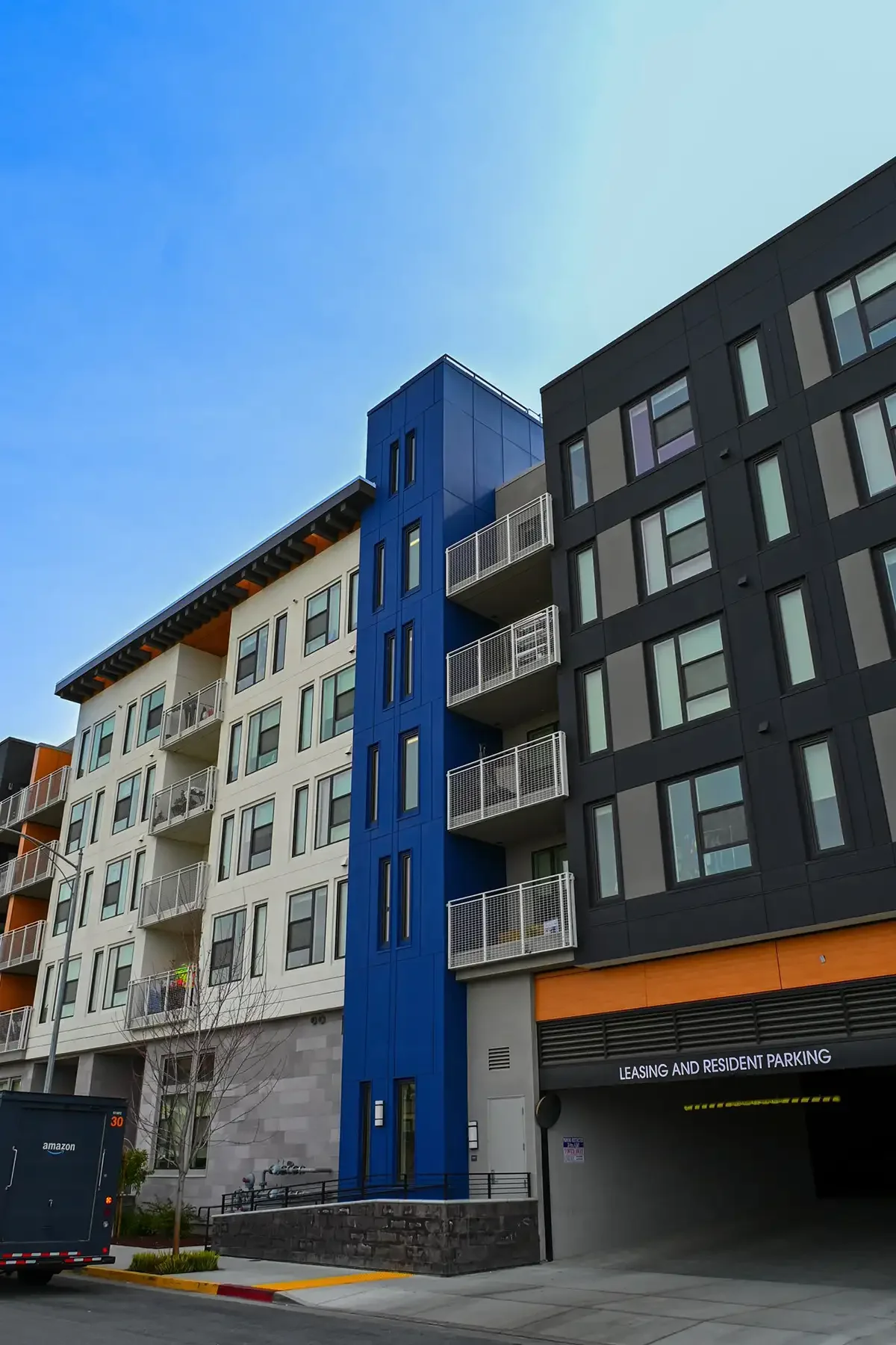 platform apartments from street showing parking entrance