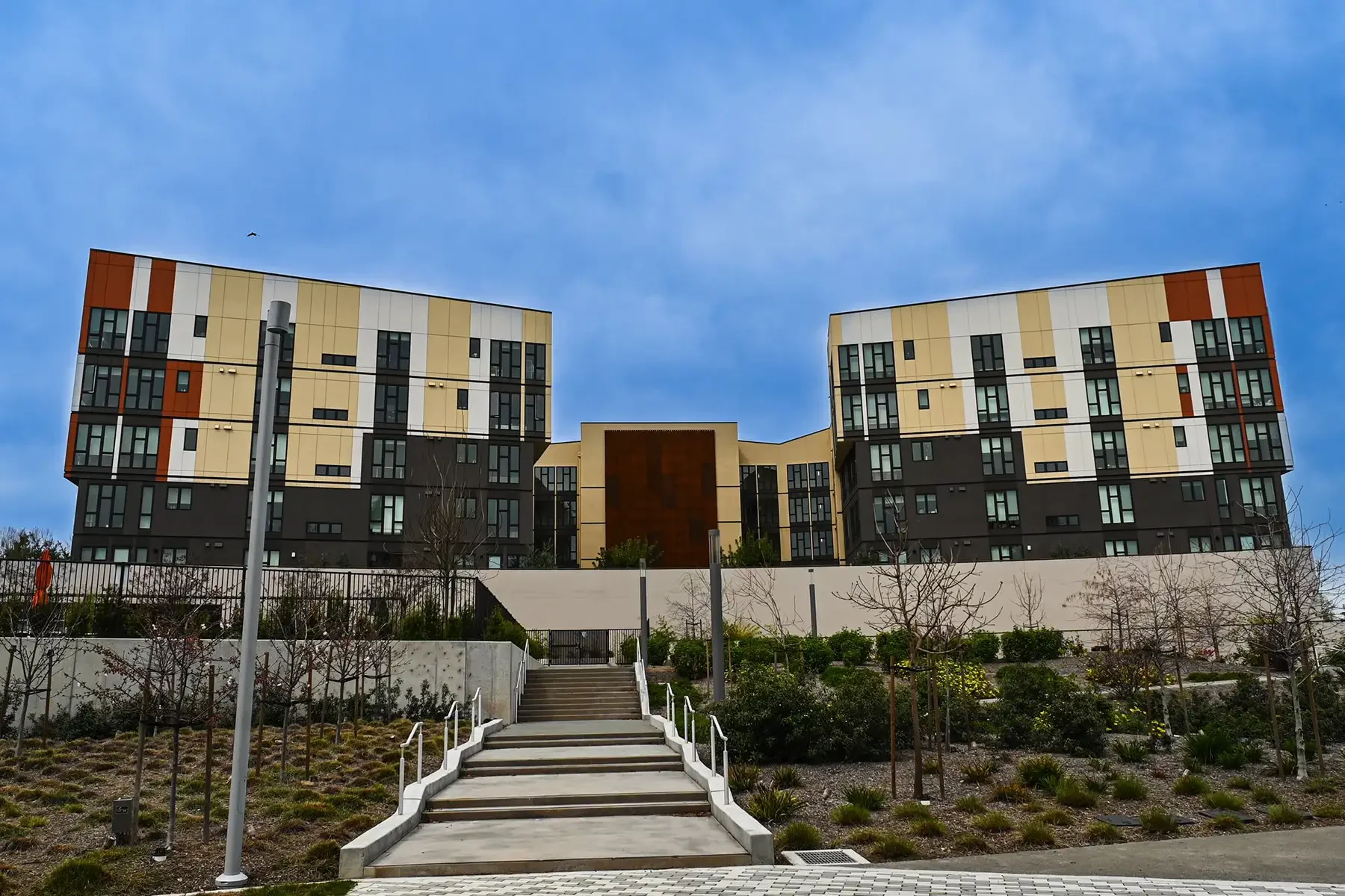 wide shot of lakeside building with stair path in foreground
