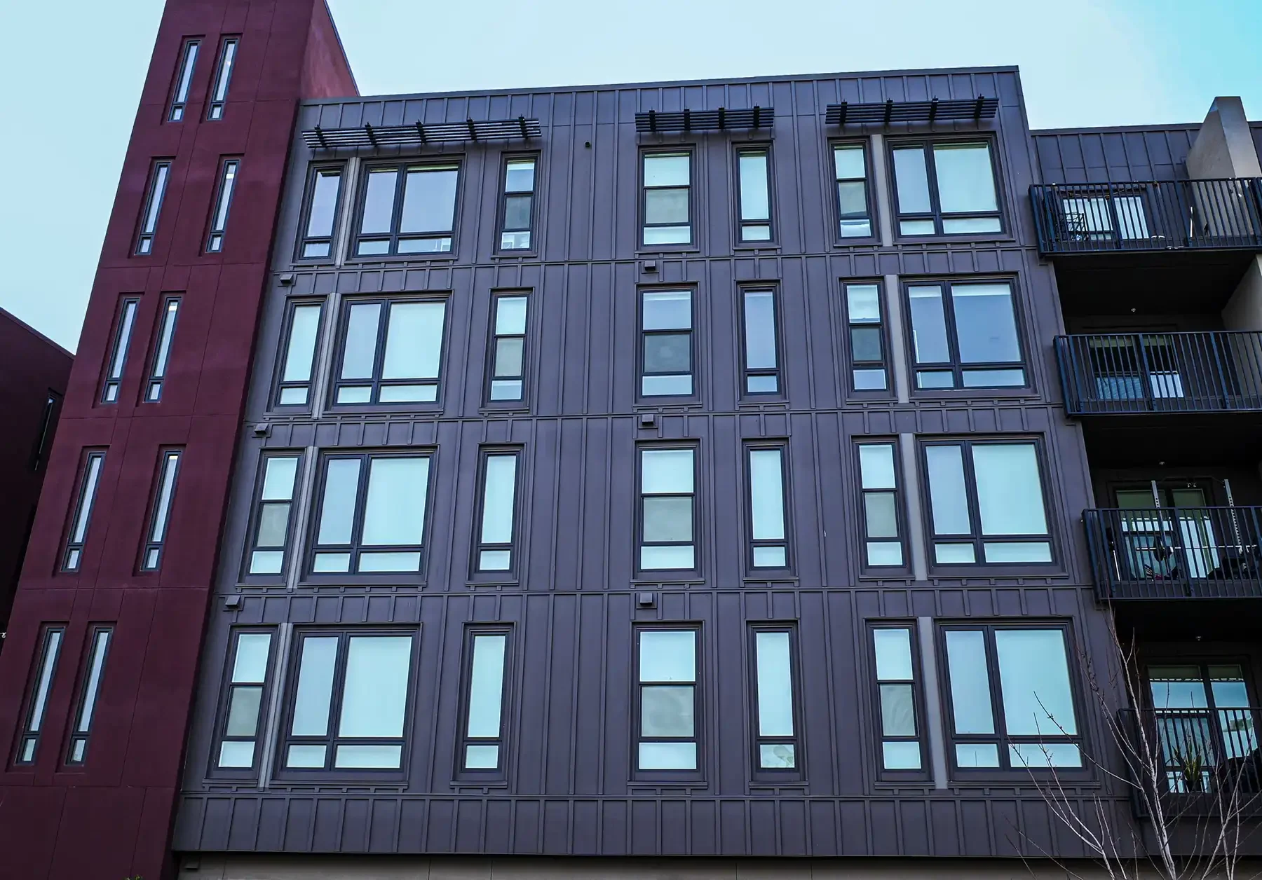 detail view of platform apartments looking up from sidewalk