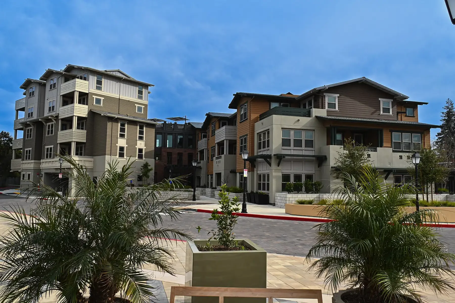 wide shot of middle plaza from distance with planters in foreground