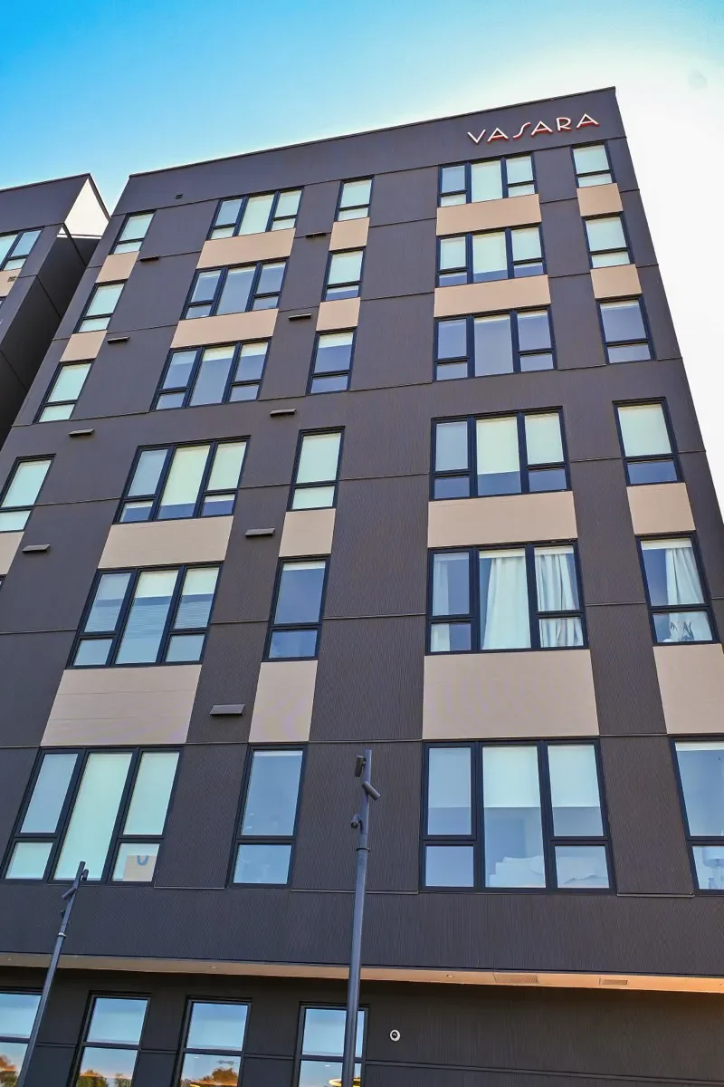 vasara gray exterior looking up from sidewalk