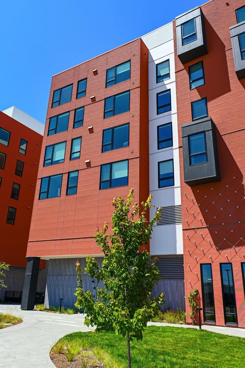 alternate angle of lume building exterior with tree in foreground