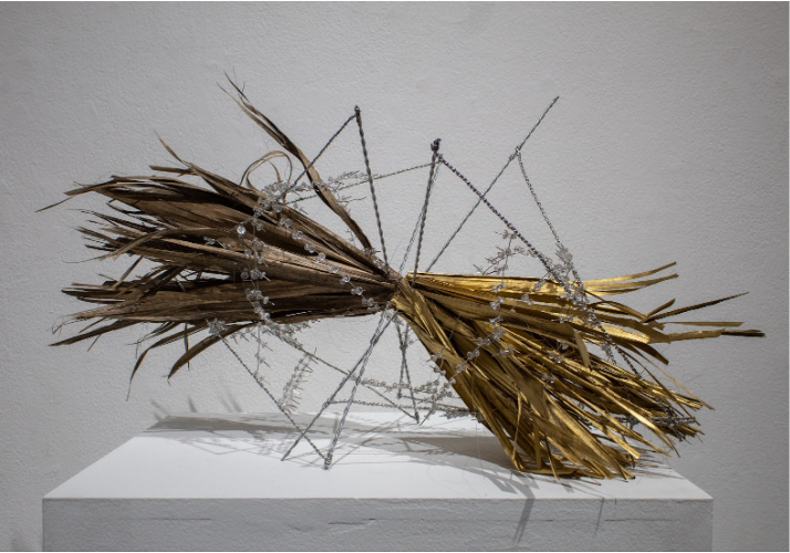 Isabella Nelson
Beautiful Substance, 2025
Wire, push pins, palm fronds, and gold spray paint

This piece is inspired by the drug issues that arise in Ocean Beach (OB). I was interested in this specific location because of the similarities I saw withi