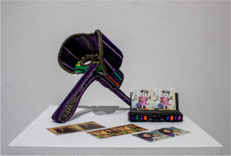 Stephania Ross
Her-storia, 2025 
Mexican bags and purses, cardboard, sewing thread, 3x magnifying lens, and wood

Exploring the concept of multiples, I landed on the medium of photography. I came to learn about stereoscopes from the early 19th centur