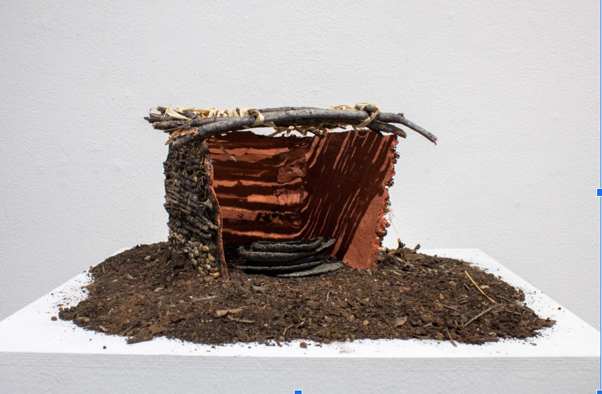 Veronica Aranda
Jacal, 2025 
Clay, corn kernel, dirt, sticks, and corn husks

A jacal is considered a hut or a shelter house in connection with the indigenous people of Mexico and the Spanish colonial structures. These types of jacals can be found in