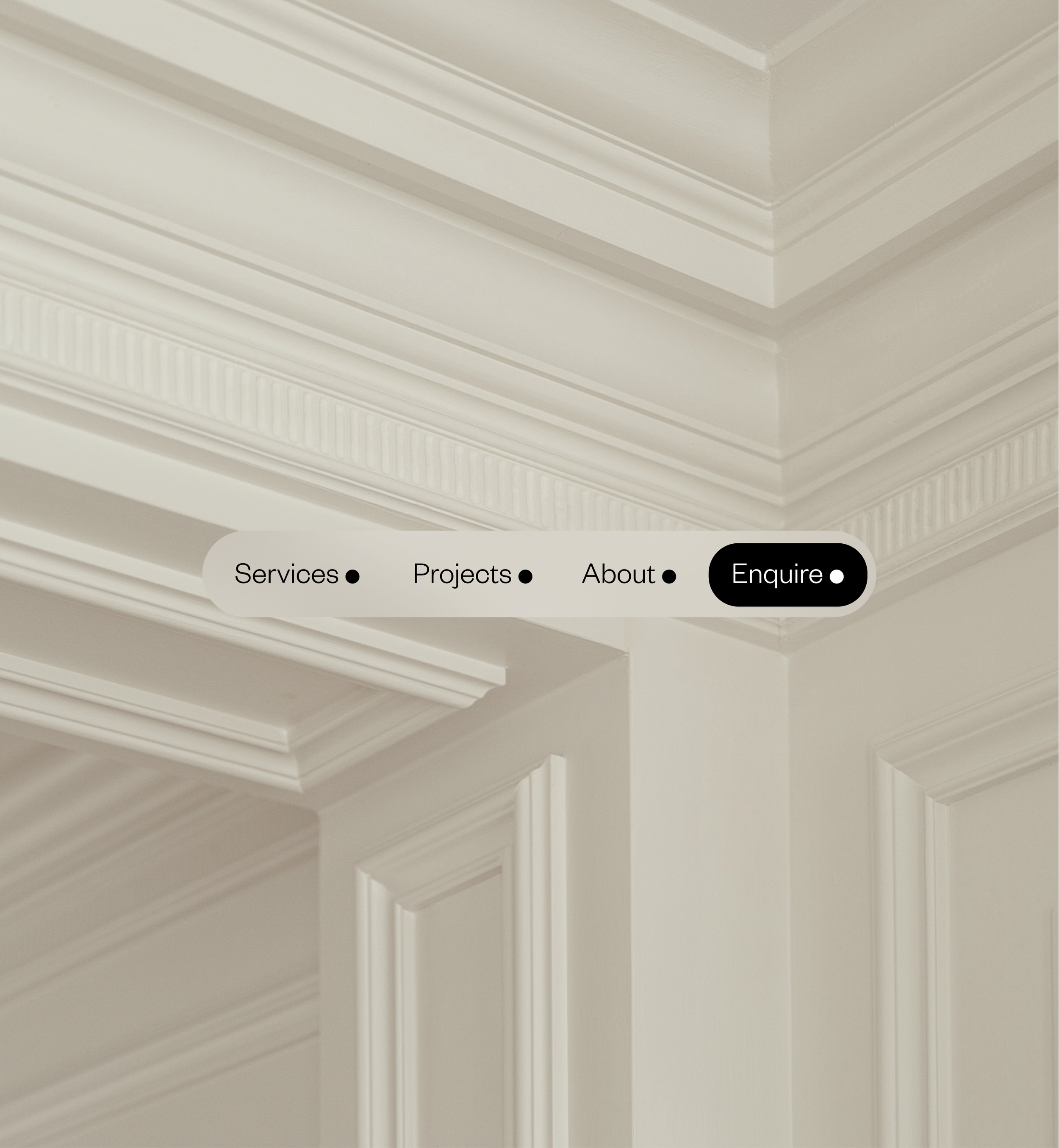 A close-up of a white, ornamental, crown molding in a room with a navigation menu overlay showing 'Services,' 'Projects,' 'About,' and 'Enquire'.
