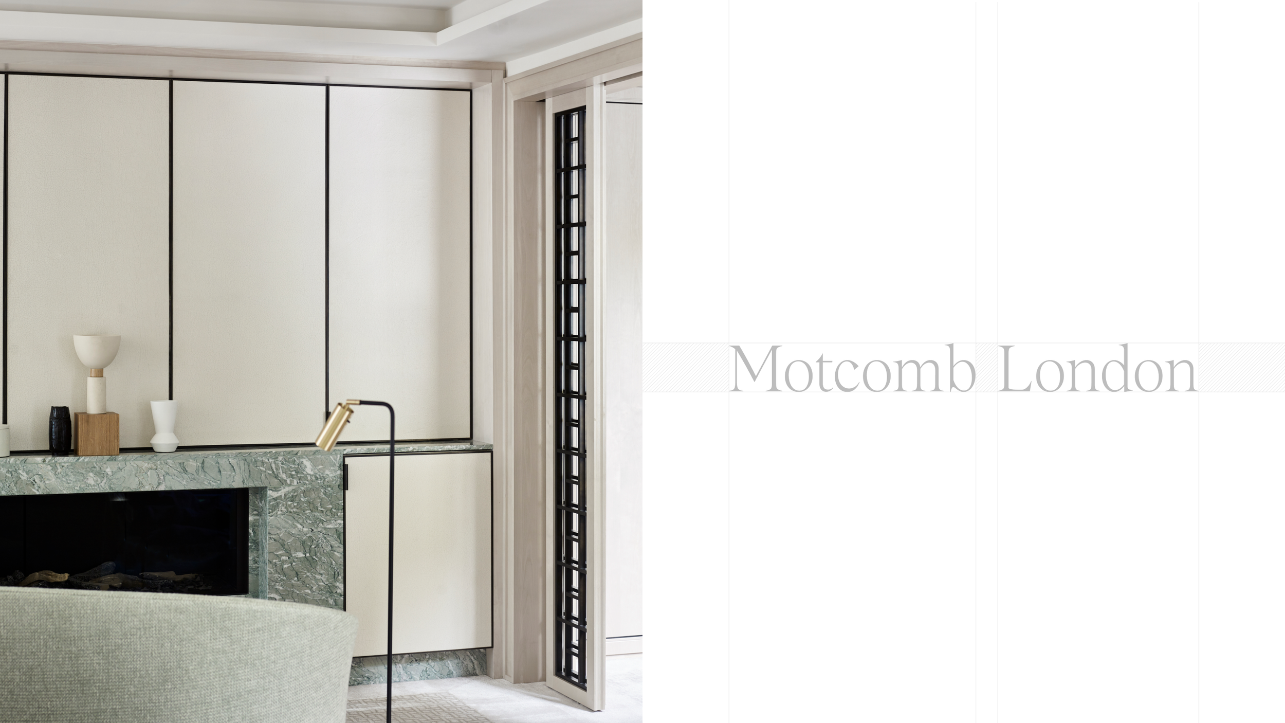 Modern living room with white walls and a fireplace with green marble surround, decorated with minimalist vases and a lamp, next to a window with black gridwork.