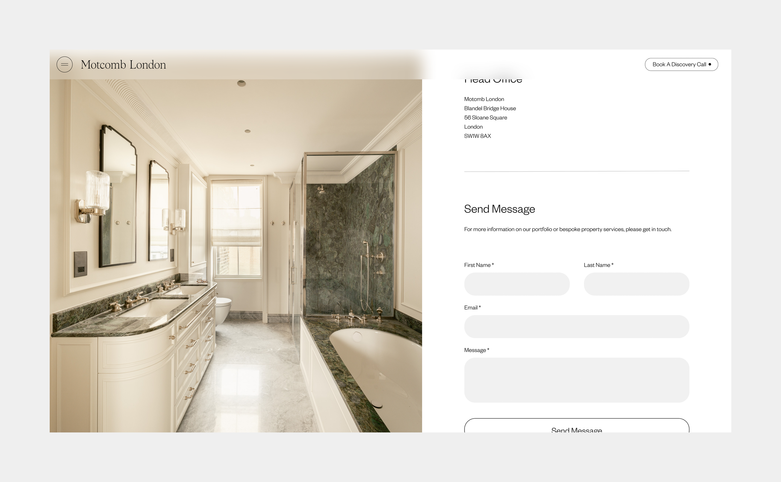 Elegant bathroom with double sinks, large mirrors, wall-mounted lights, a window, a bathtub with green marble surround, and a separate glass-enclosed shower with matching green marble walls.
