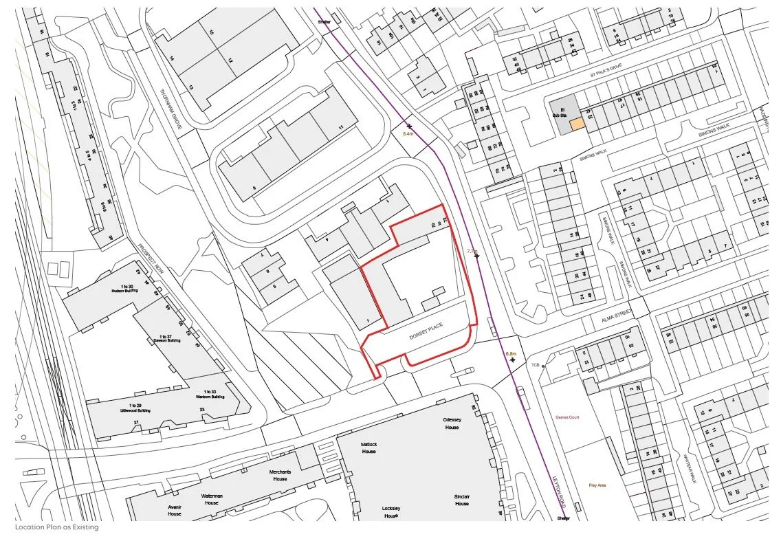 A detailed technical map of a neighborhood showing property boundaries, buildings, streets, and utility lines, with a specific property outlined in red and measurements marked along a nearby line.