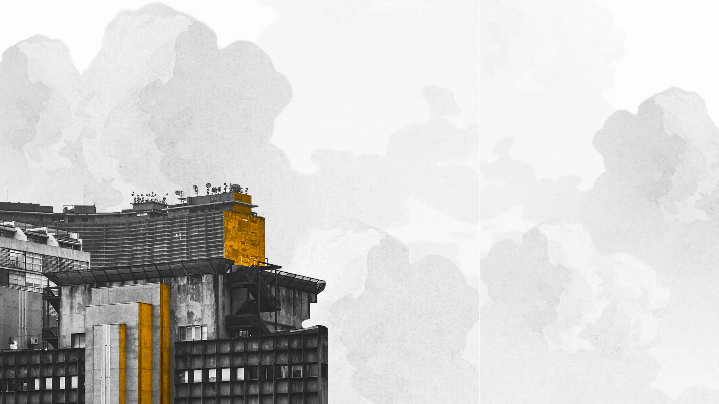 A construction crane extending high into the sky at sunset, with a building under construction in the foreground.