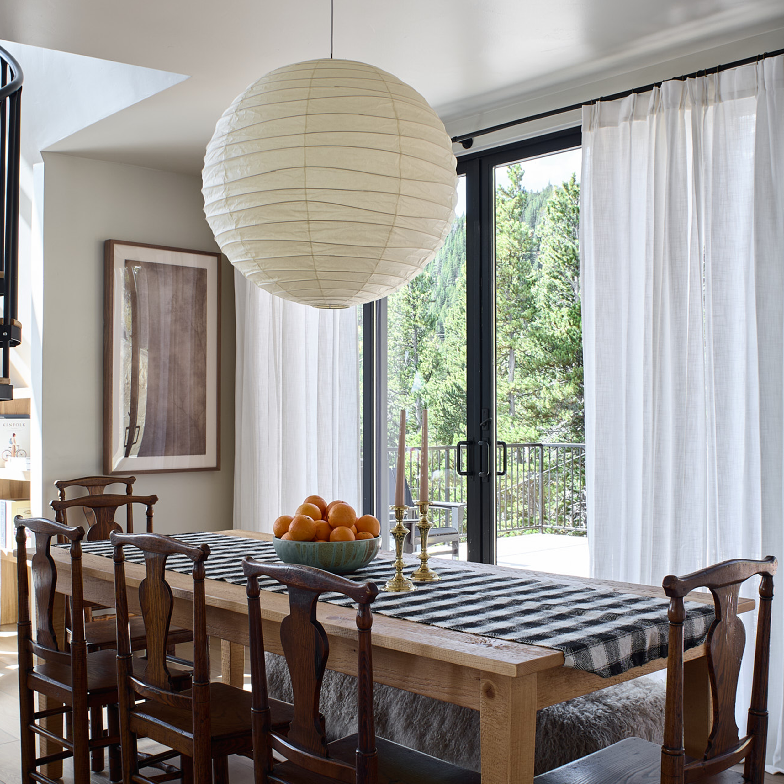 Custom build cabin designed by Charleston Interior Designer. High end interior design for short term rental interior design. Dining room project with vintage chairs. 