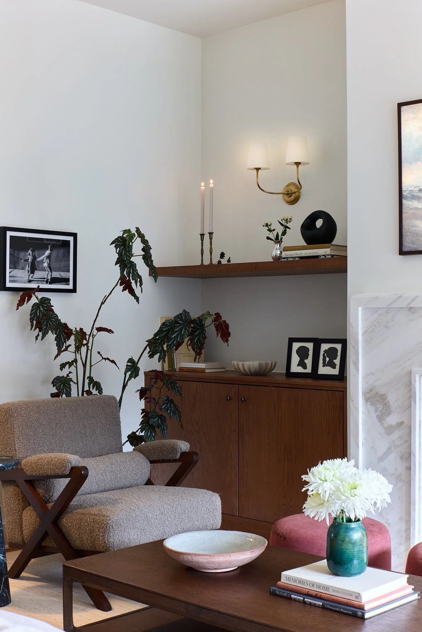 Custom furniture featured in a full home renovation designed and managed by Charleston interior designer Sarah Hart Interior Design. Custom Lawson Fencing chairs next to custom built-ins and a marble fireplace surround. 