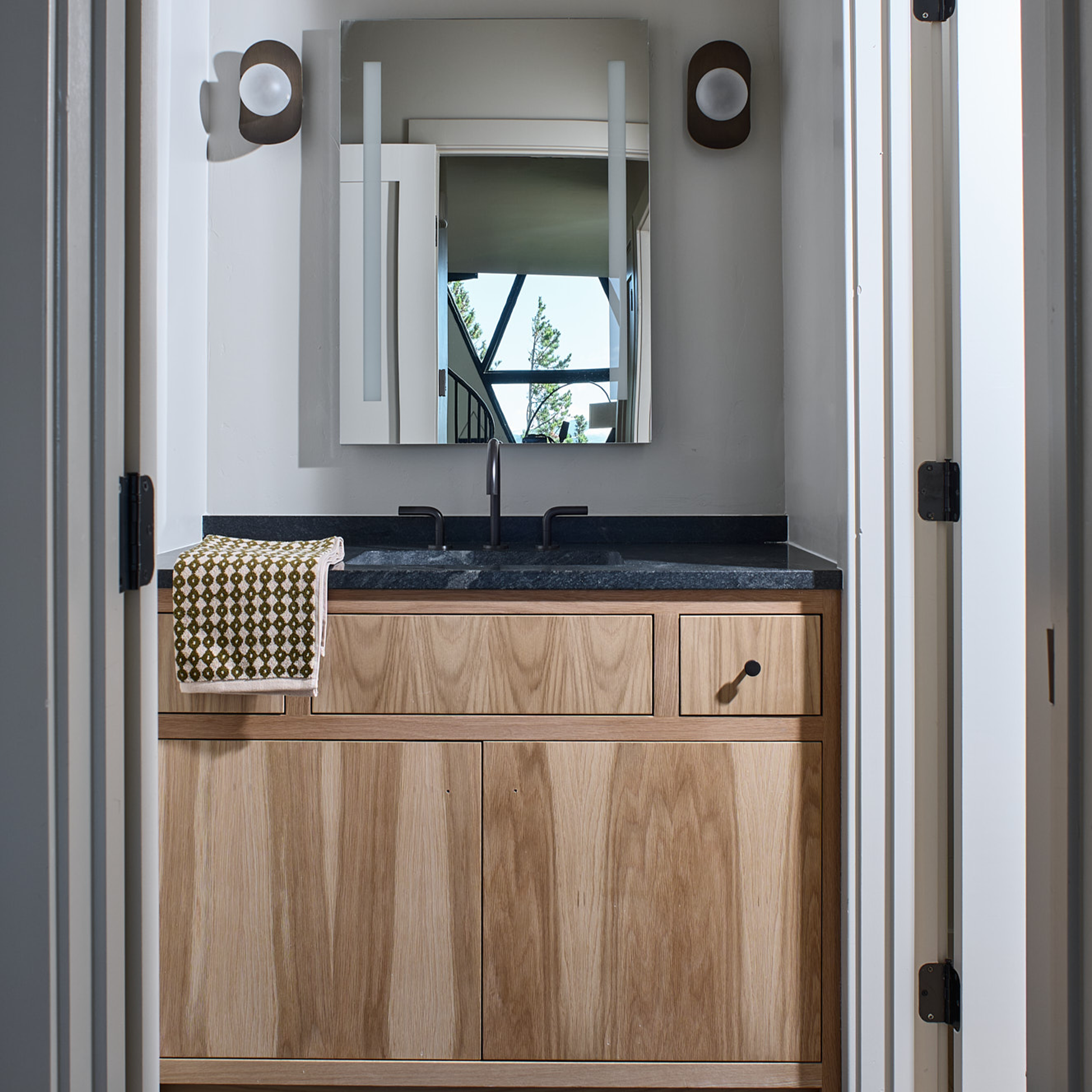 Custom build cabin designed by Charleston Interior Designer. High end interior design for short term rental interior design. Bathroom design. 