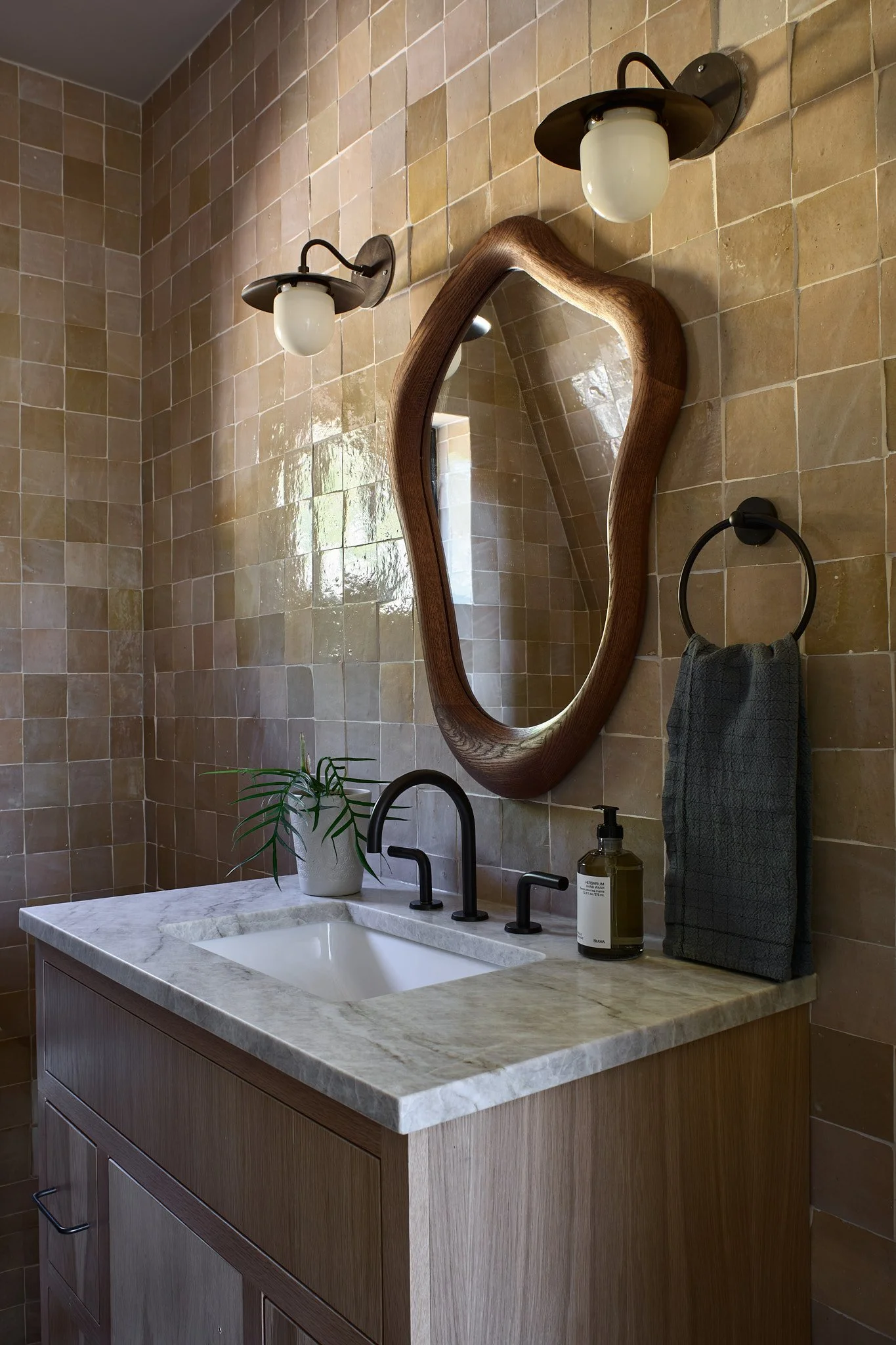 Charleston interior designer Sarah Hart created this luxury short-term rental A-Frame with custom furnishings, white oak cabinetry, handmade ceramics, and one-of-a-kind lighting.