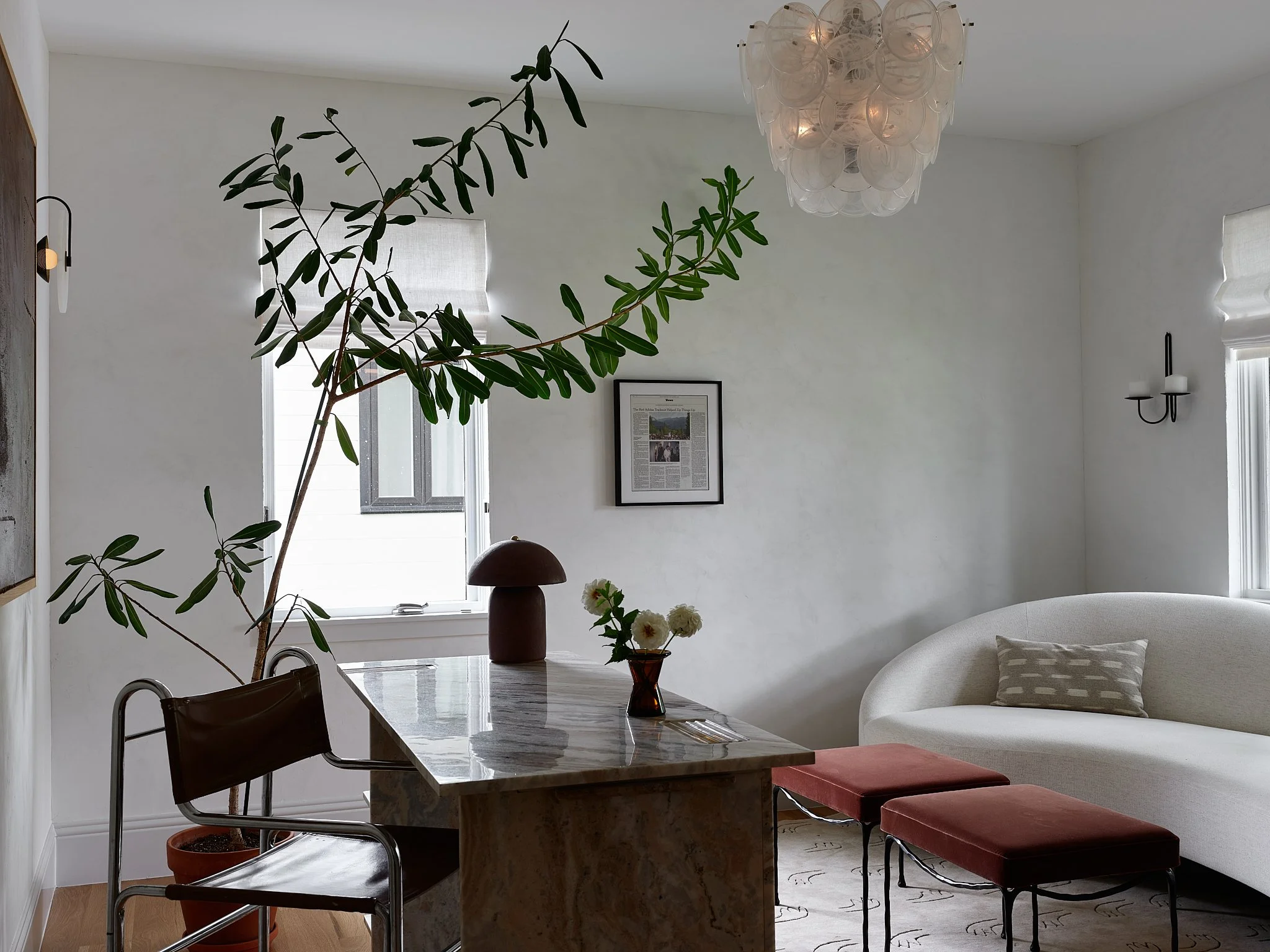 Sarah Hart Interior Design in Charleston created the Minimalist Chateau interior featuring a fully custom kitchen with La Cornue range, marble countertops, SubZero fridge, plaster walls, and custom window treatments.