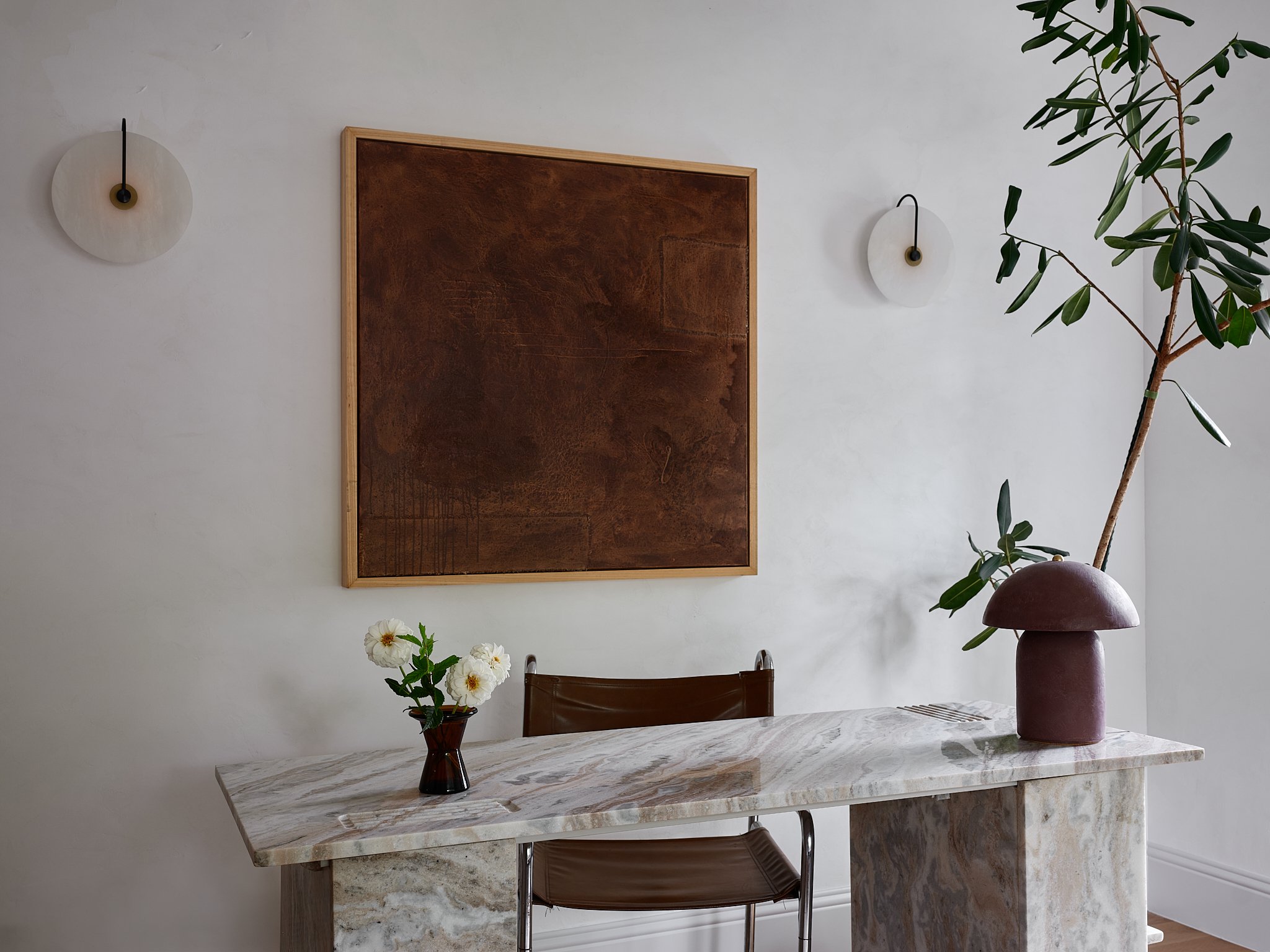 Sarah Hart Interior Design in Charleston created the Minimalist Chateau interior featuring a fully custom kitchen with La Cornue range, marble countertops, SubZero fridge, plaster walls, and custom window treatments.