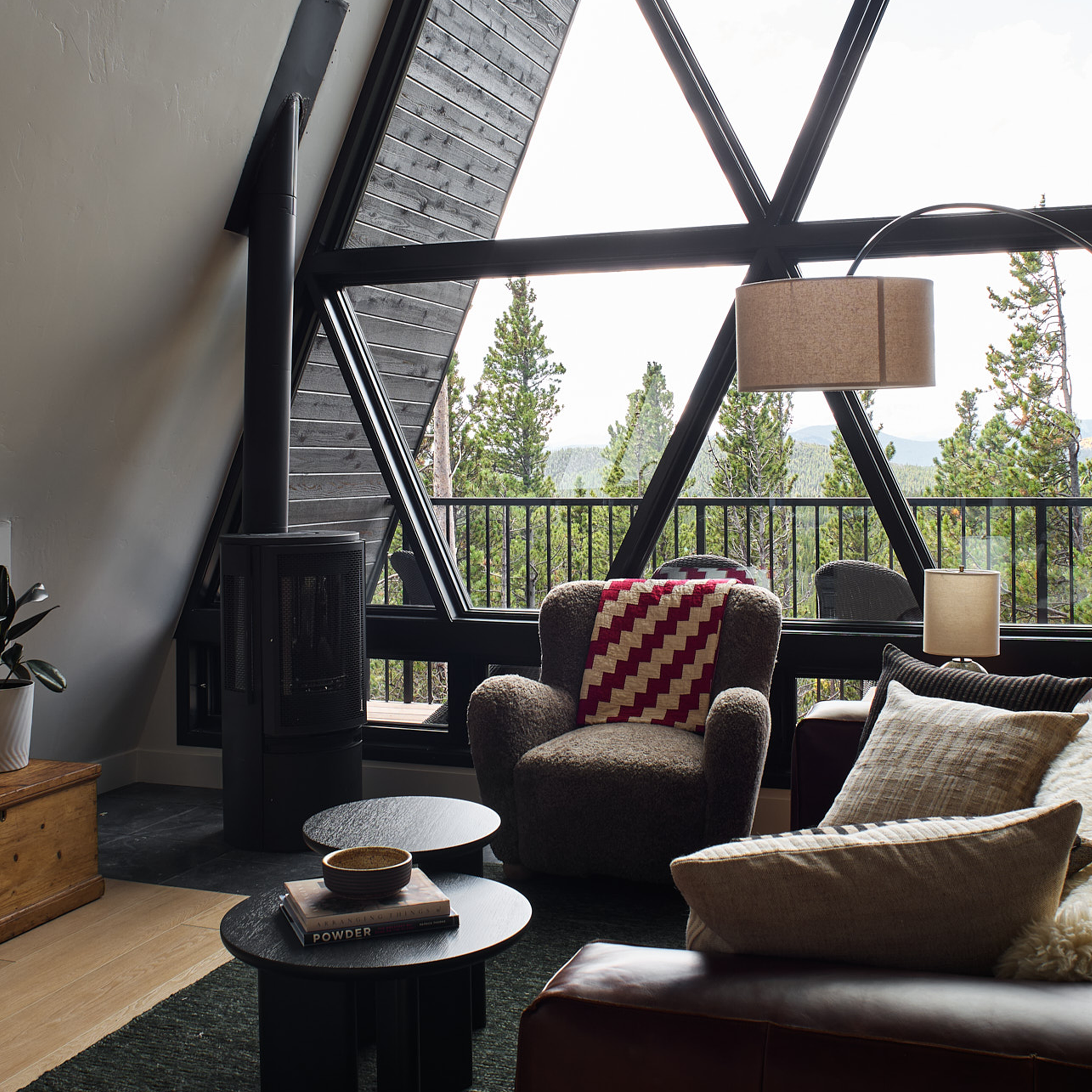 Custom build cabin designed by Charleston Interior Designer. High end interior design for short term rental interior design. Living room design with vintage items.