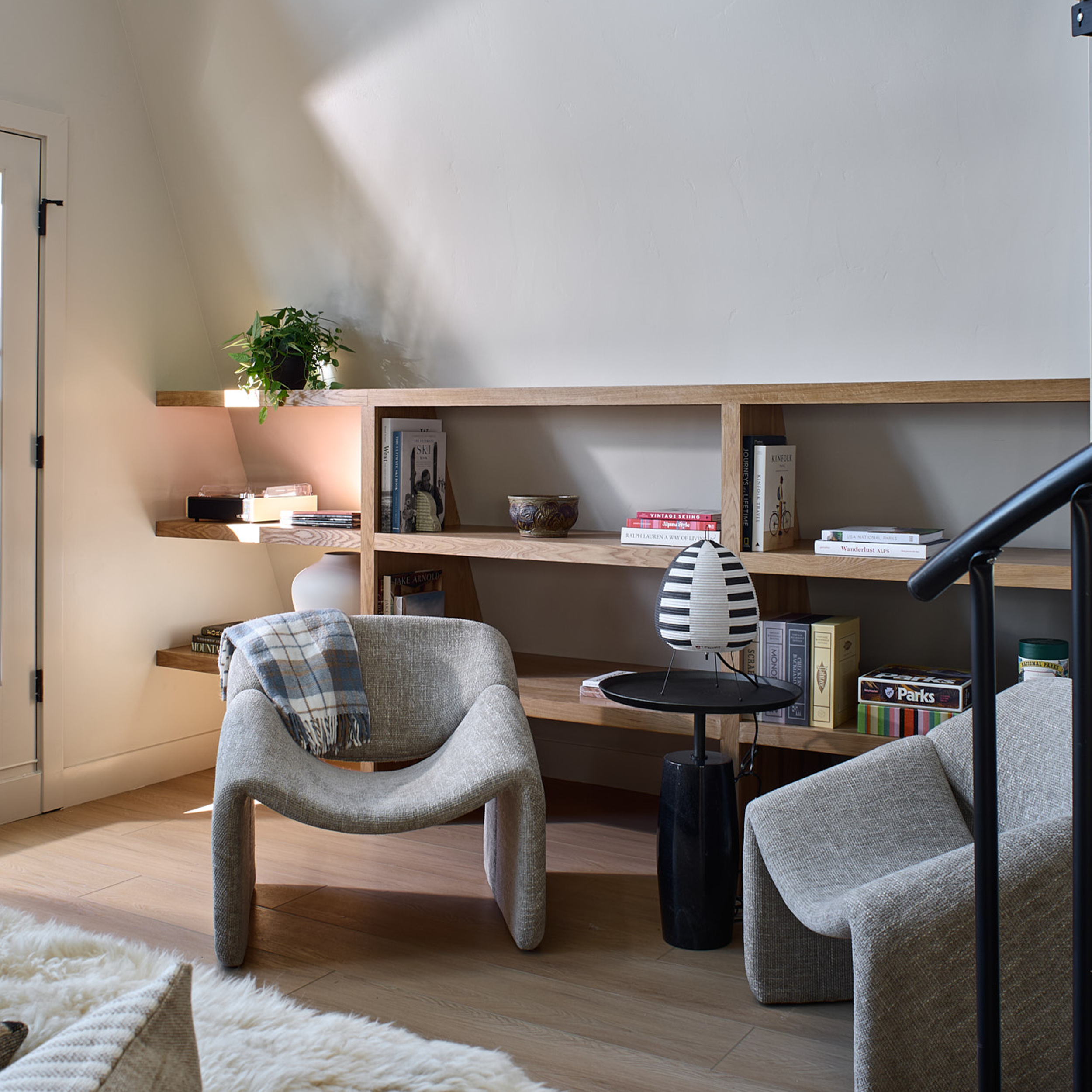 Custom build cabin designed by Charleston Interior Designer. High end interior design for short term rental interior design. Sitting room with custom built in in short term rental project.