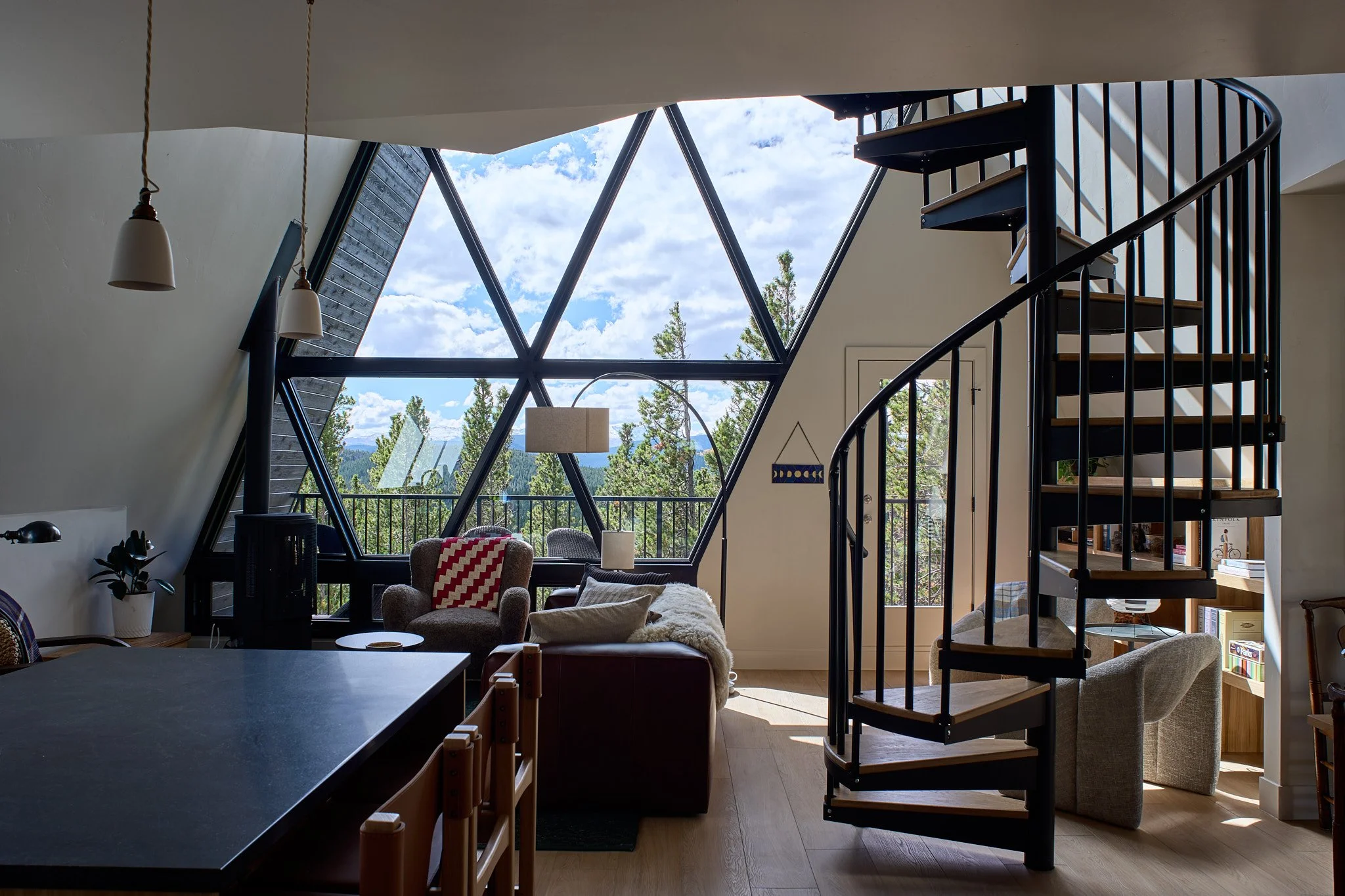 Luxury interior design by Charleston interior designer Sarah Hart for a custom new-build A-Frame luxury short-term rental, featuring white oak cabinetry, handmade ceramics, custom lighting, and bespoke furnishings.