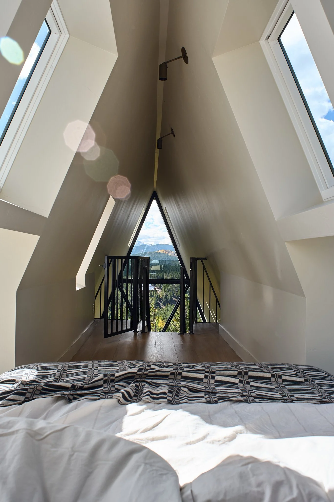 Charleston interior designer Sarah Hart created this luxury short-term rental A-Frame with custom furnishings, white oak cabinetry, handmade ceramics, and one-of-a-kind lighting.
