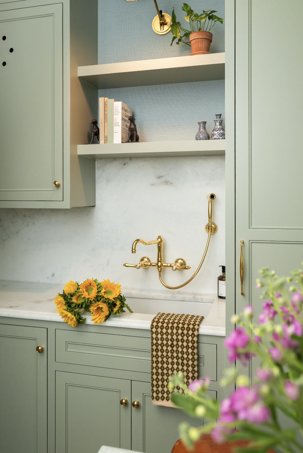 Mudroom project located in Mount Pleasant, South Carolina by Denver interior designer Sarah Hart. Custom cabinetry and a marble backsplash.