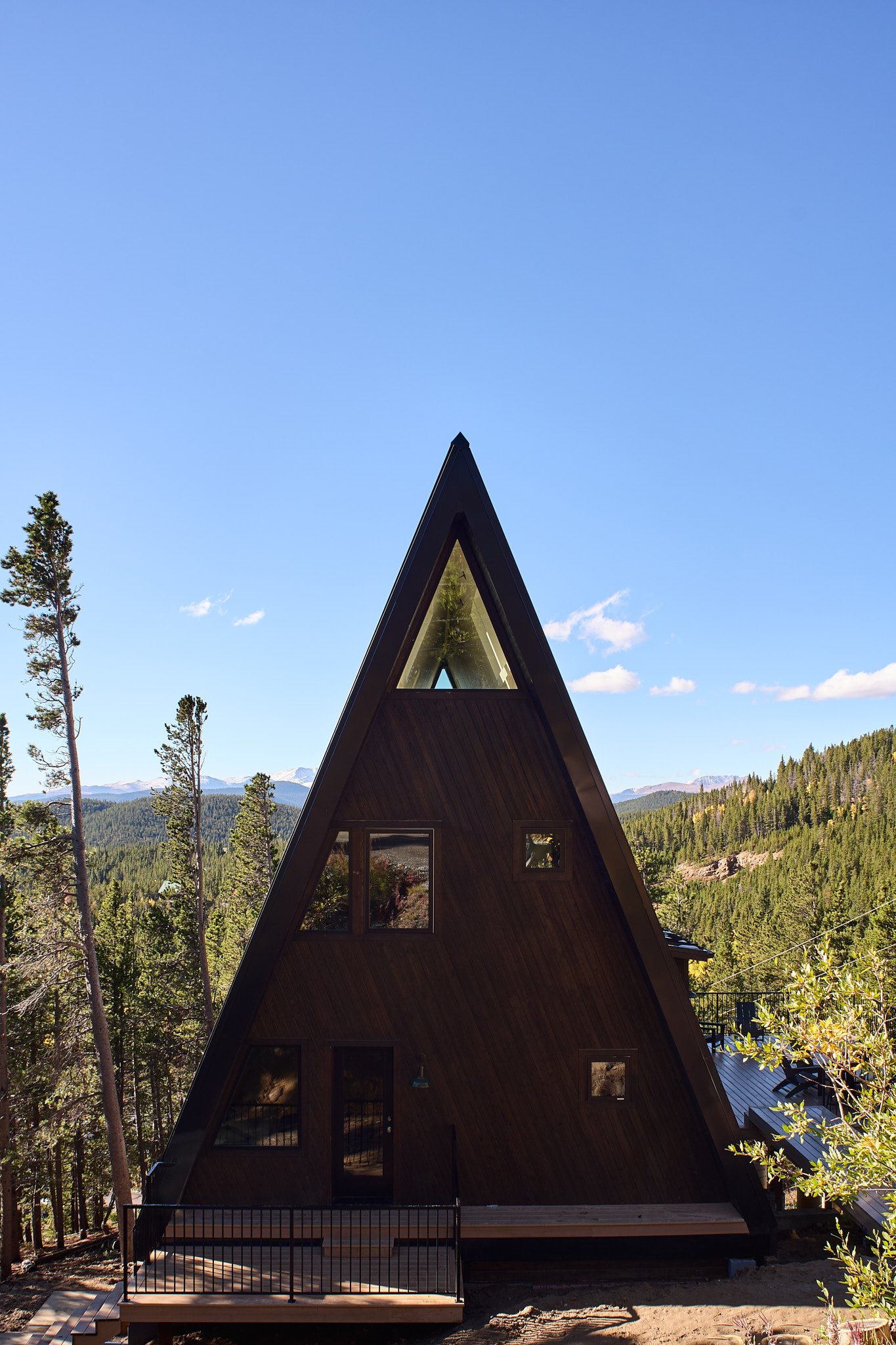 Luxury interior design by Charleston interior designer Sarah Hart for a custom new-build A-Frame luxury short-term rental, featuring white oak cabinetry, handmade ceramics, custom lighting, and bespoke furnishings.