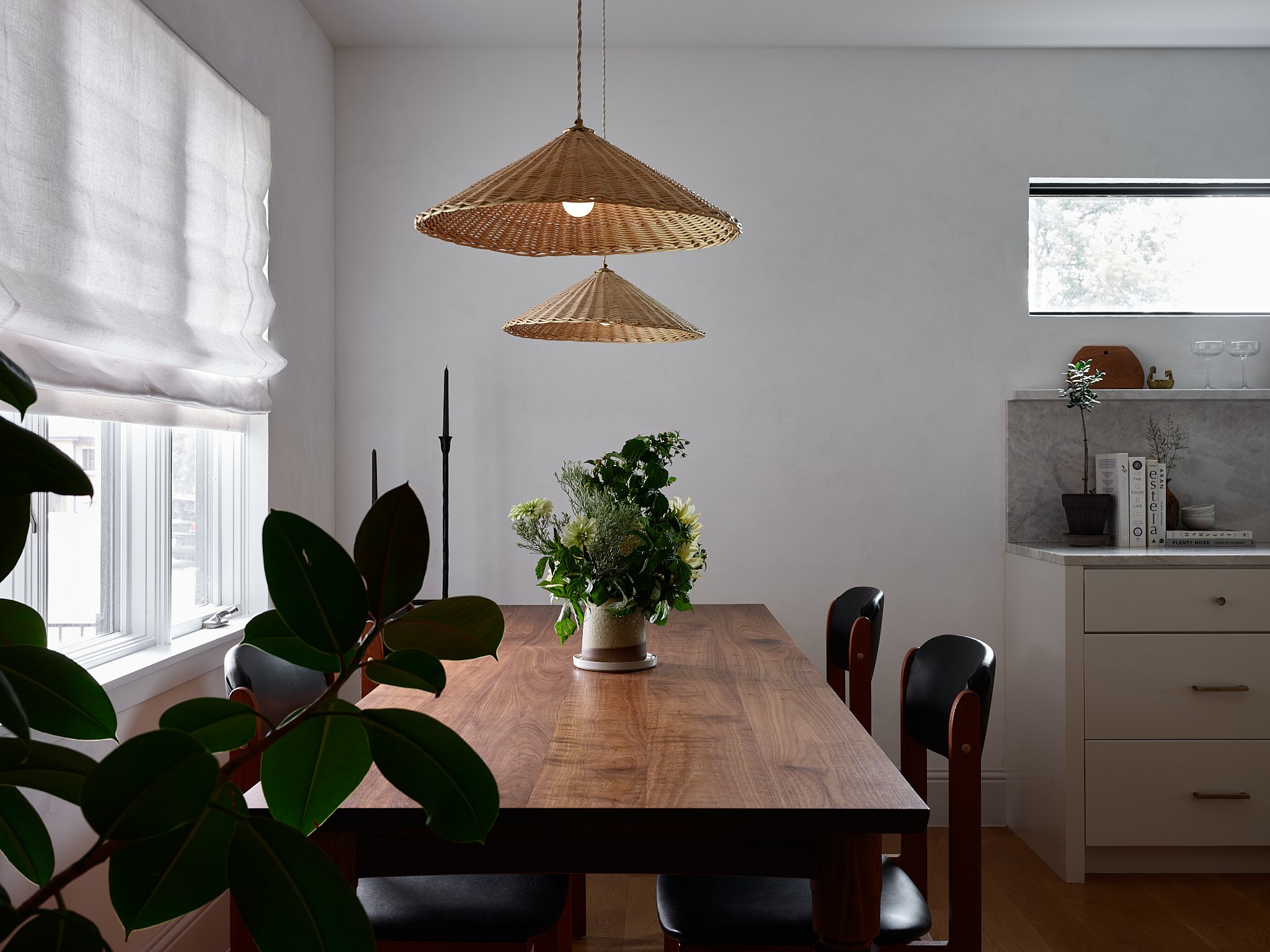 Luxury Charleston interior design project: the Minimalist Chateau with bespoke kitchen, custom window treatments, La Cornue range, marble countertops, custom range hood, and SubZero appliances.