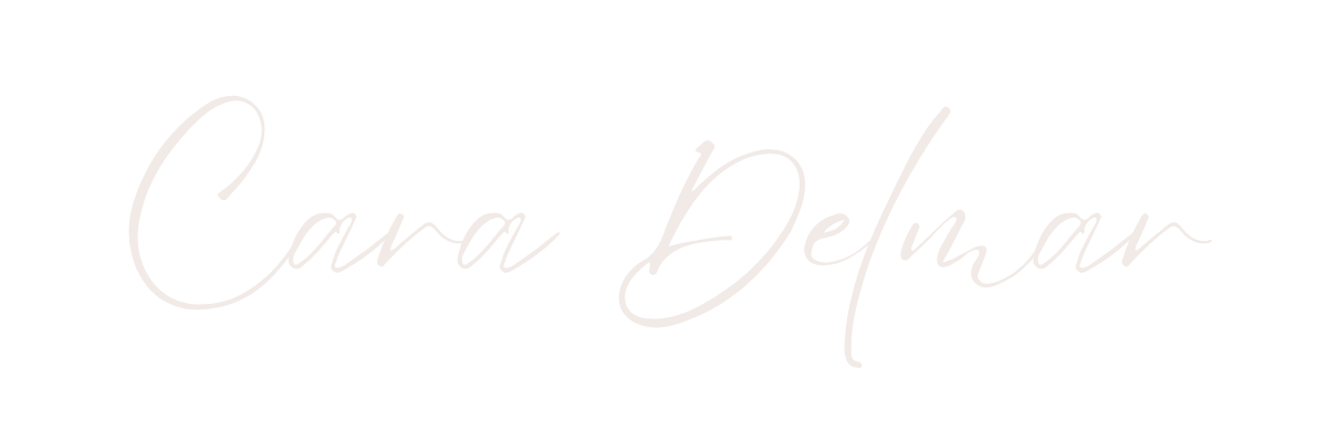 Signature-style text that reads 'Cara Delmar' on a black background.
