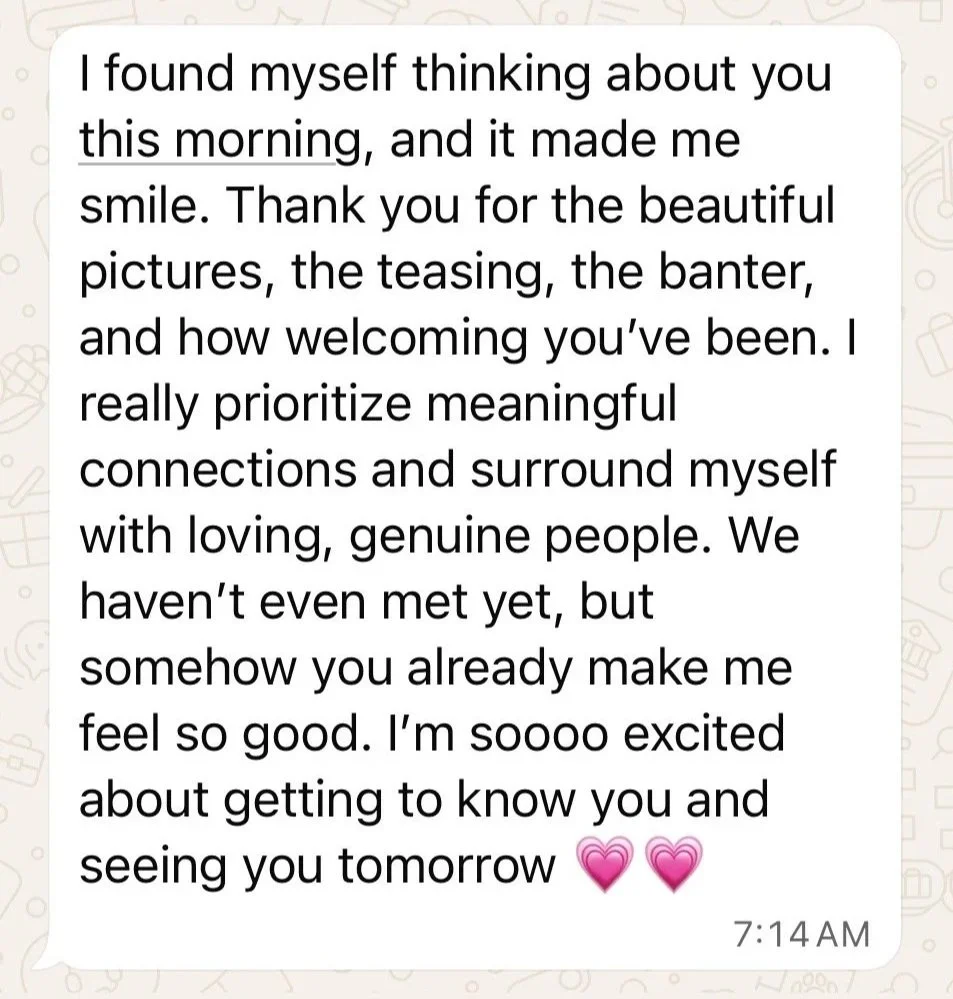 Text message expressing feelings of happiness and anticipation about getting to know someone, with pink heart emojis at the end.