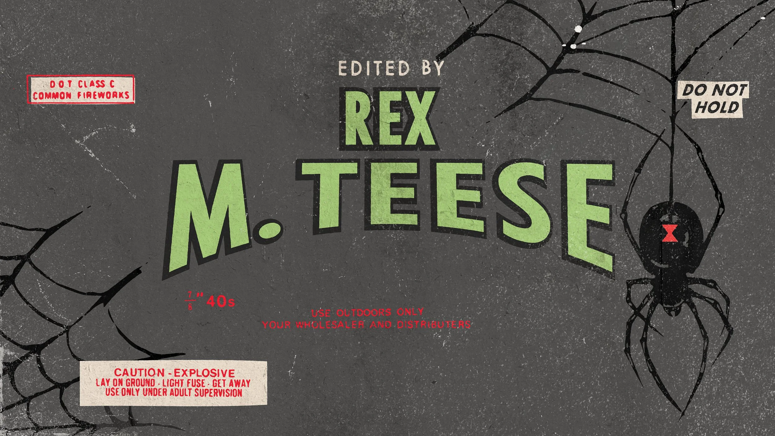 Close-up of a black Halloween firework packaging with spider and web illustrations, warning labels, and green and white text.